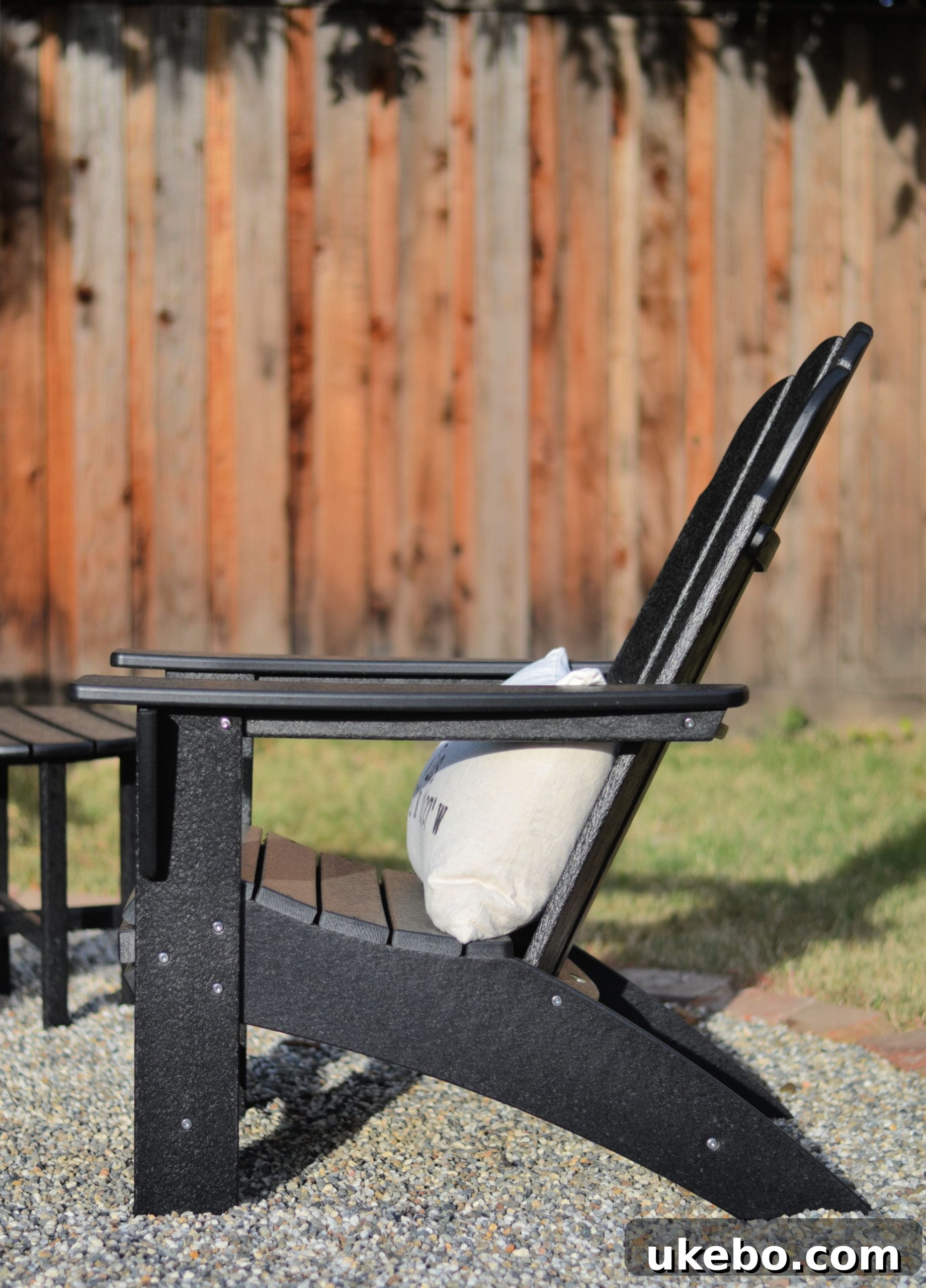 Crafting Your Perfect Summer Outdoor Oasis with POLYWOOD 19 Side view highlighting the ergonomic curve-back design of the Adirondack chair