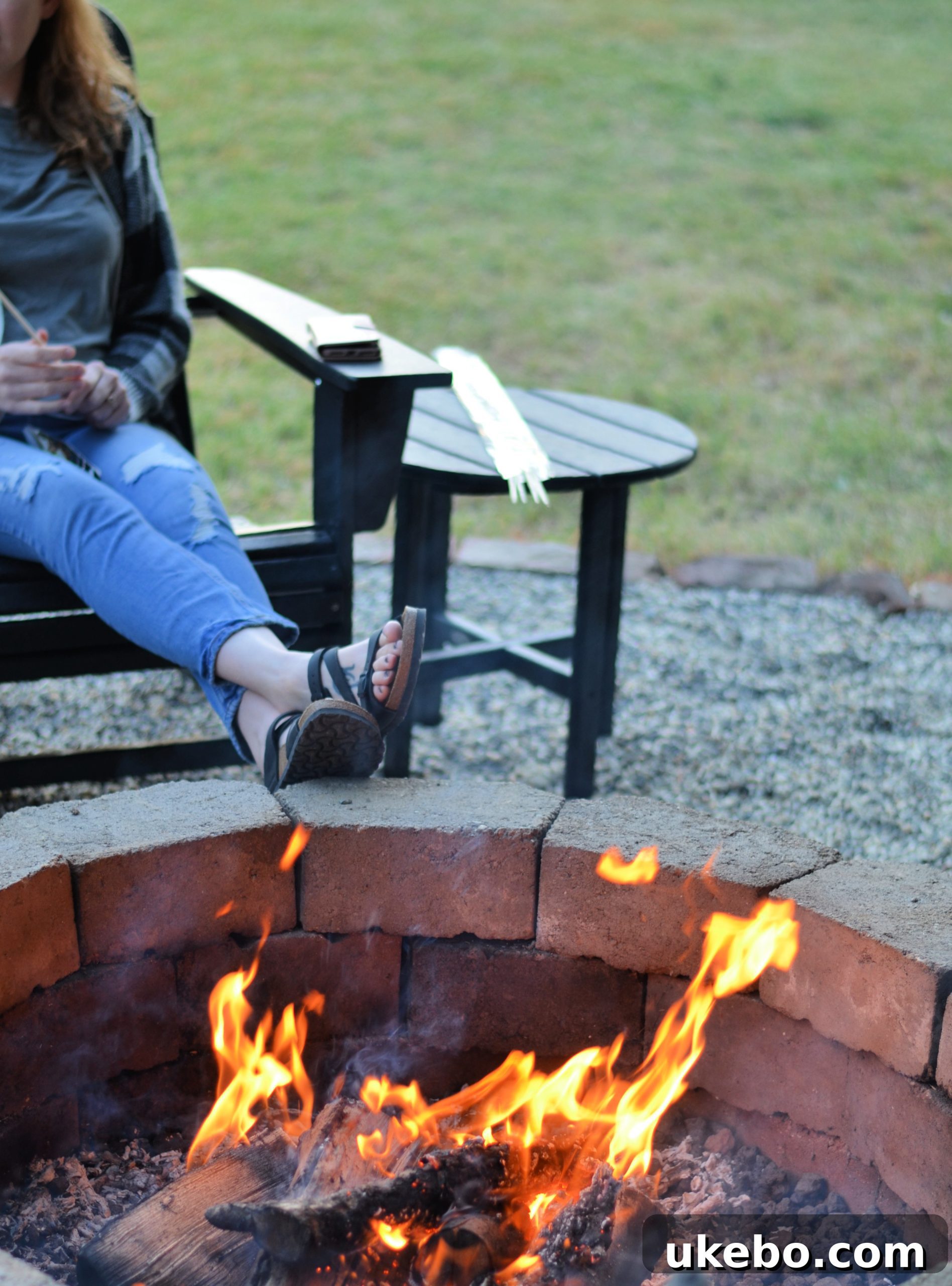Crafting Your Perfect Summer Outdoor Oasis with POLYWOOD 25 Friends gathered around the fire pit for s'mores night