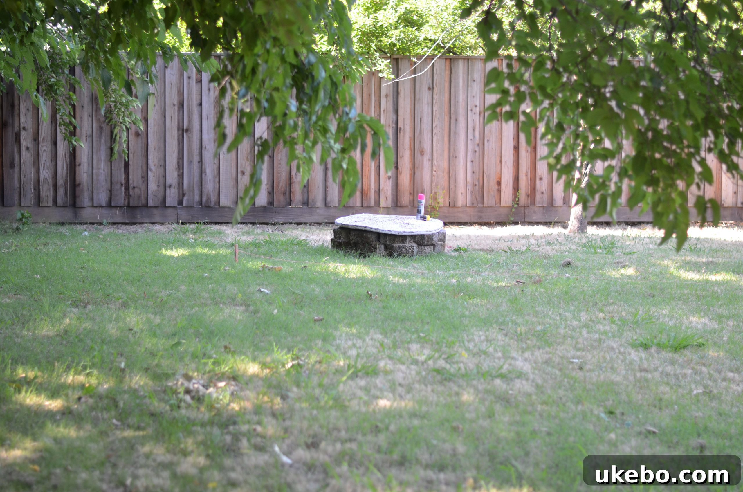 Crafting Your Perfect Summer Outdoor Oasis with POLYWOOD 7 Another view of the rustic, temporary fire pit in the backyard