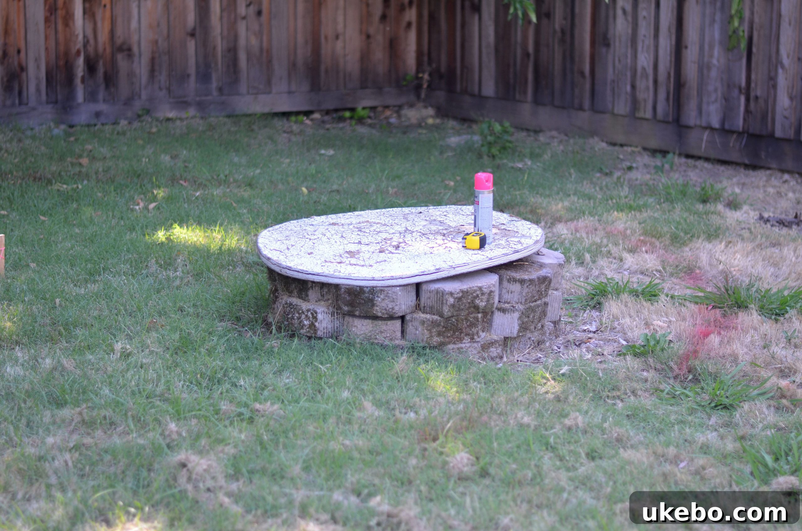 Wide shot showing the temporary fire pit setup in the yard