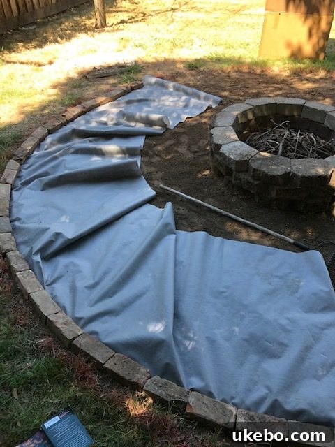 Crafting Your Perfect Summer Outdoor Oasis with POLYWOOD 10 Michael working on rebuilding the fire pit area