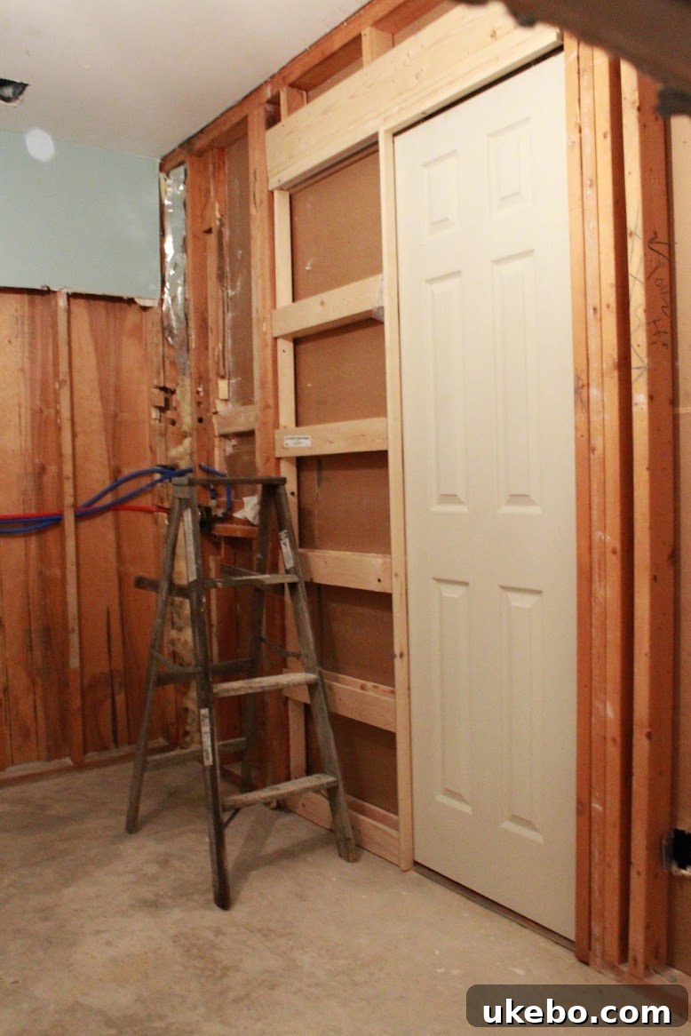 New pocket door frames installed in a renovated bathroom.