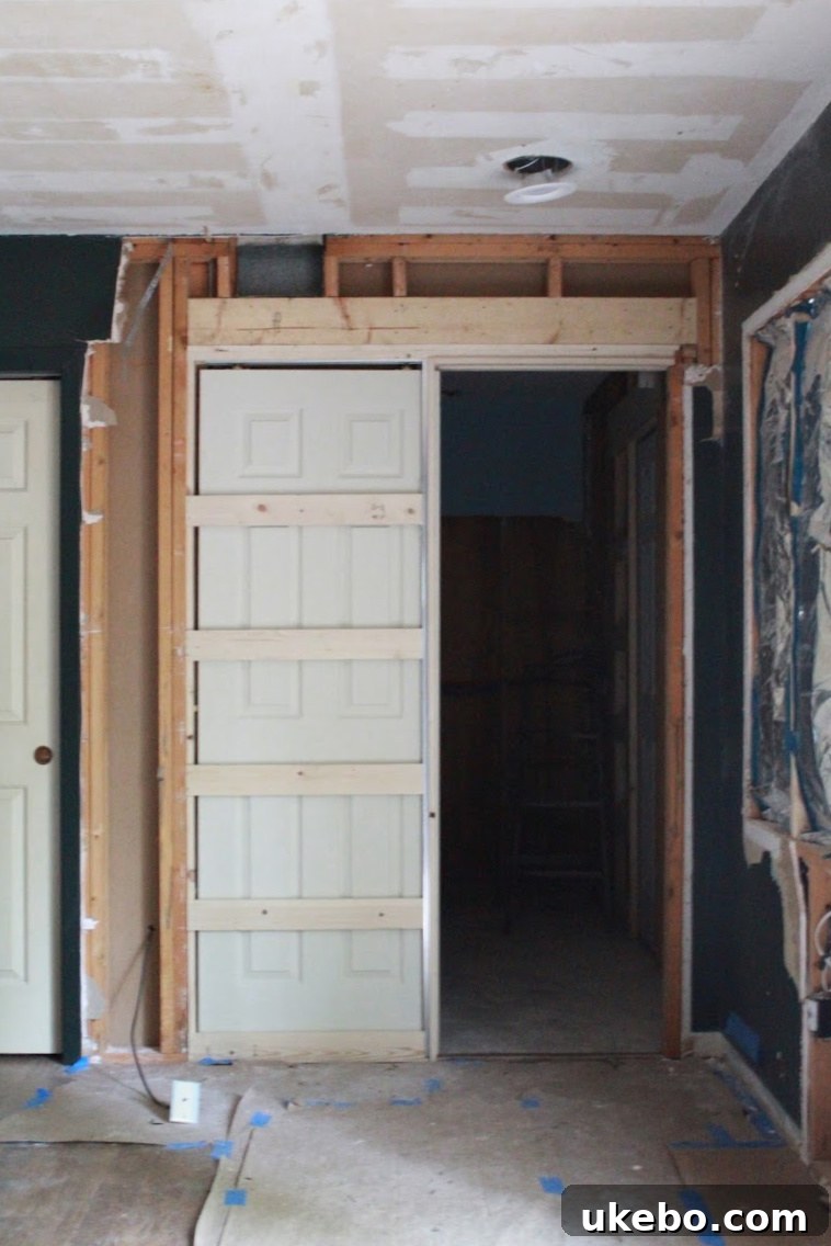 Pocket door installation showing framing and track for space-saving design.