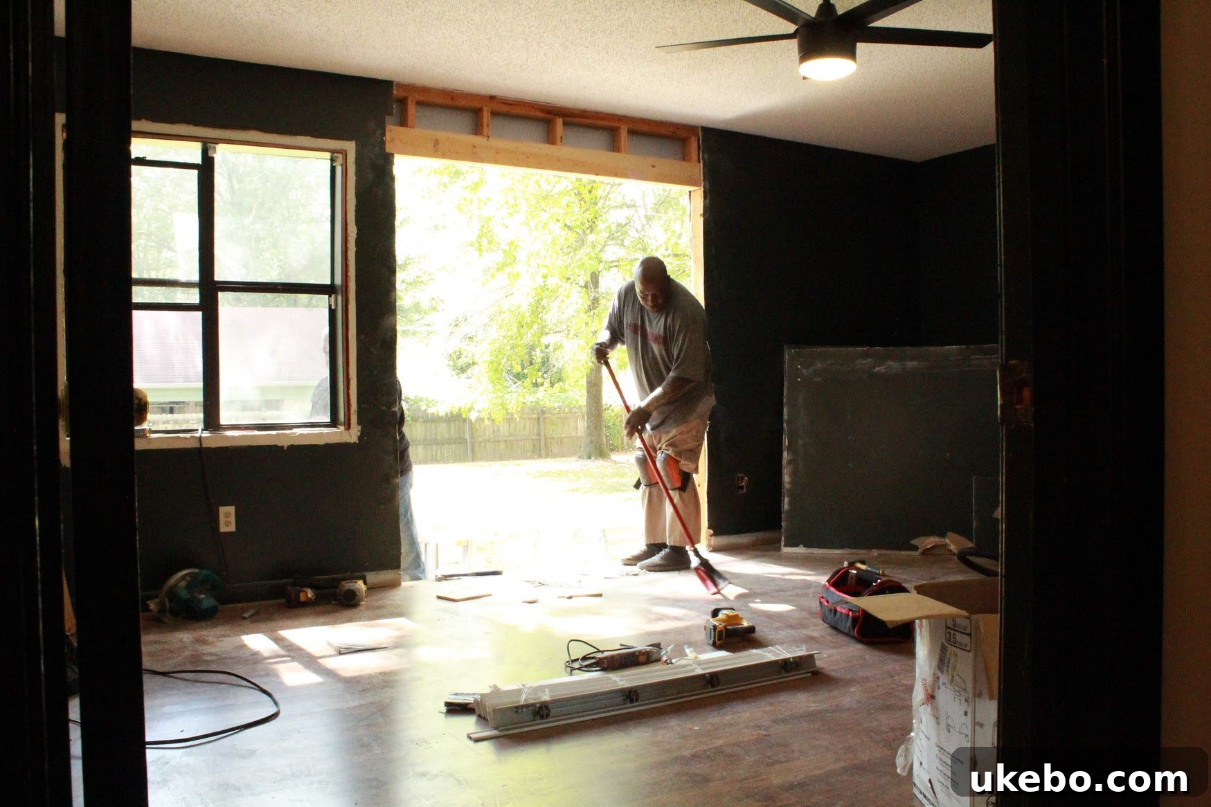 New French doors installed in master bedroom, replacing old window.