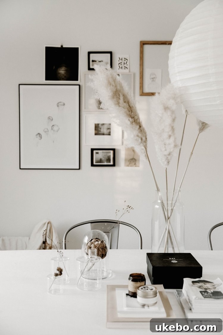 Pampas grass decor enhancing a serene Scandinavian-boho interior with light wood and muted tones