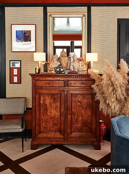 Pampas grass beautifully integrated into a rich, eclectic maximalist interior with varied artwork and textiles