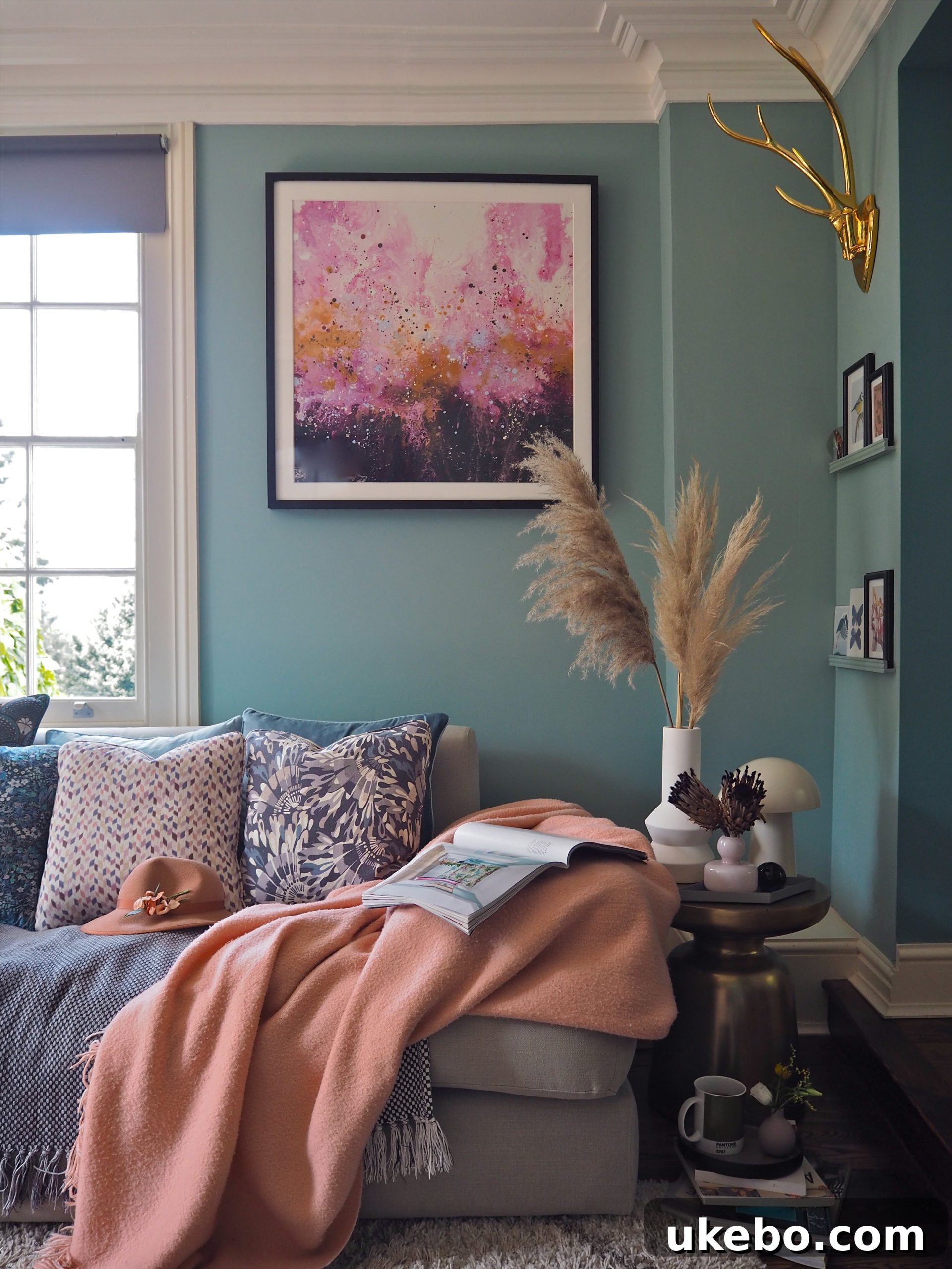 A striking pampas grass display complementing a colorful and art-filled room, adding natural texture