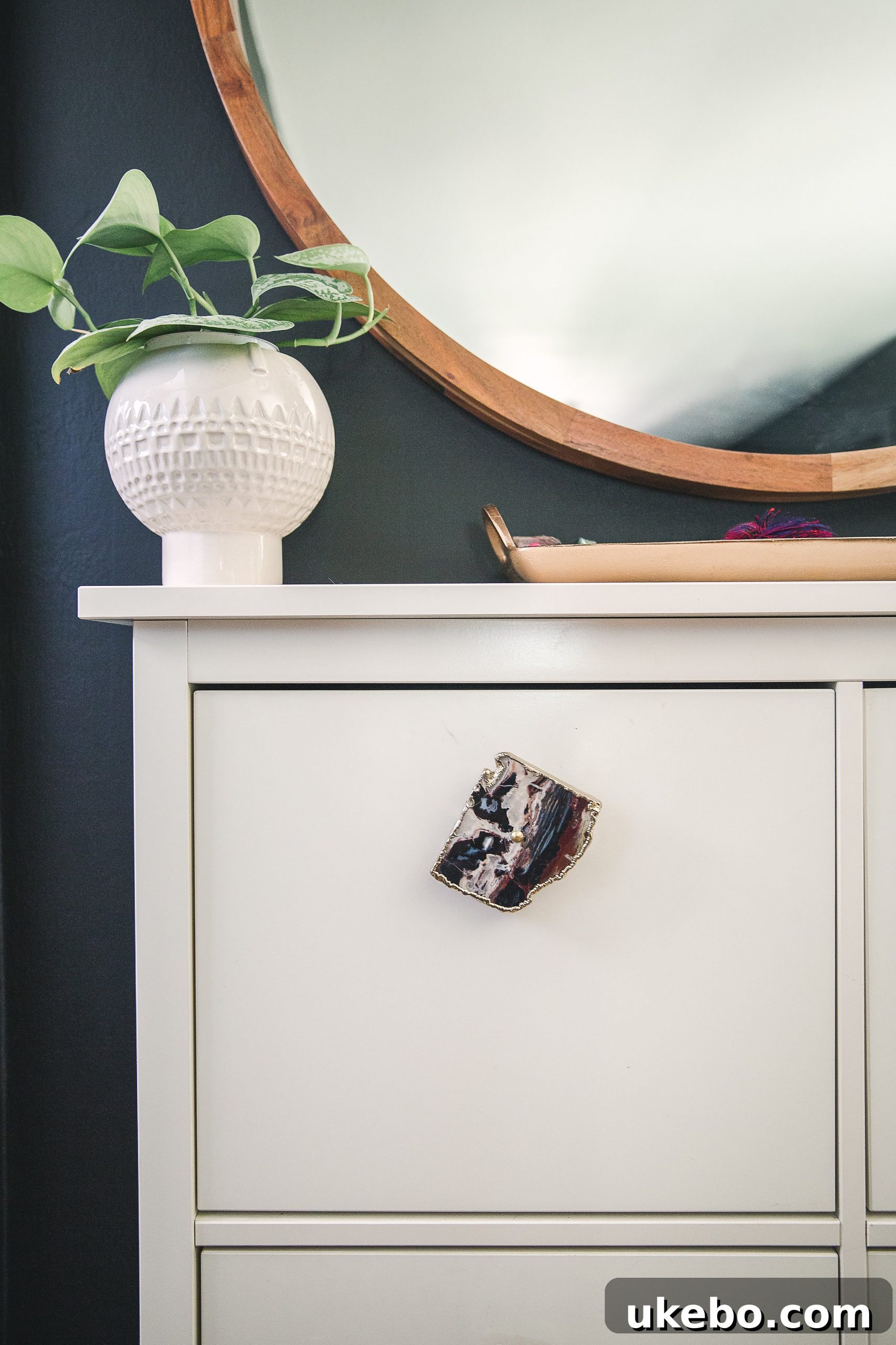 Close-up of a HEMNES shoe cabinet with custom agate knobs, showcasing a stylish upgrade.