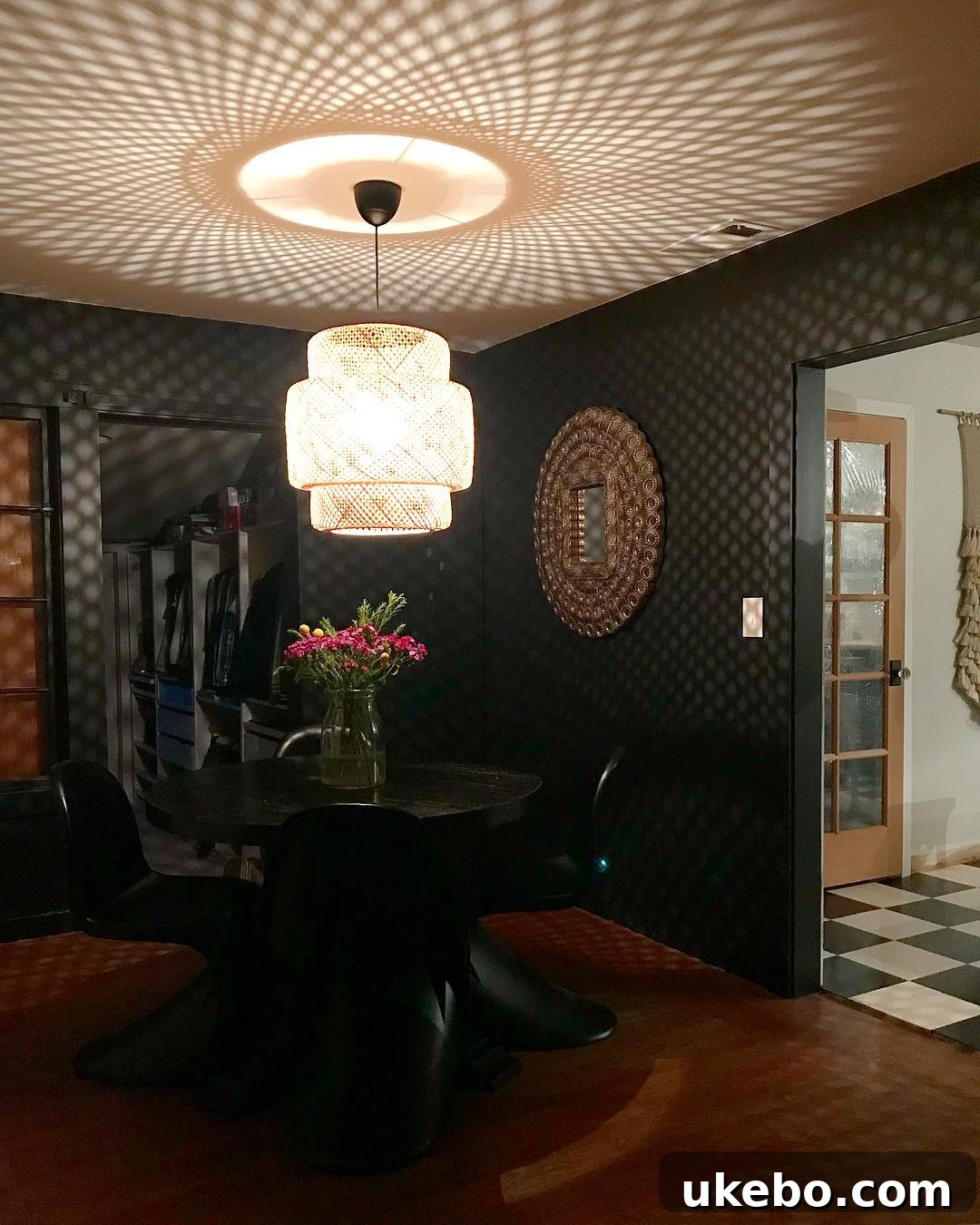 SINNERLIG pendant light showcasing its detailed bamboo weave and warm glow.