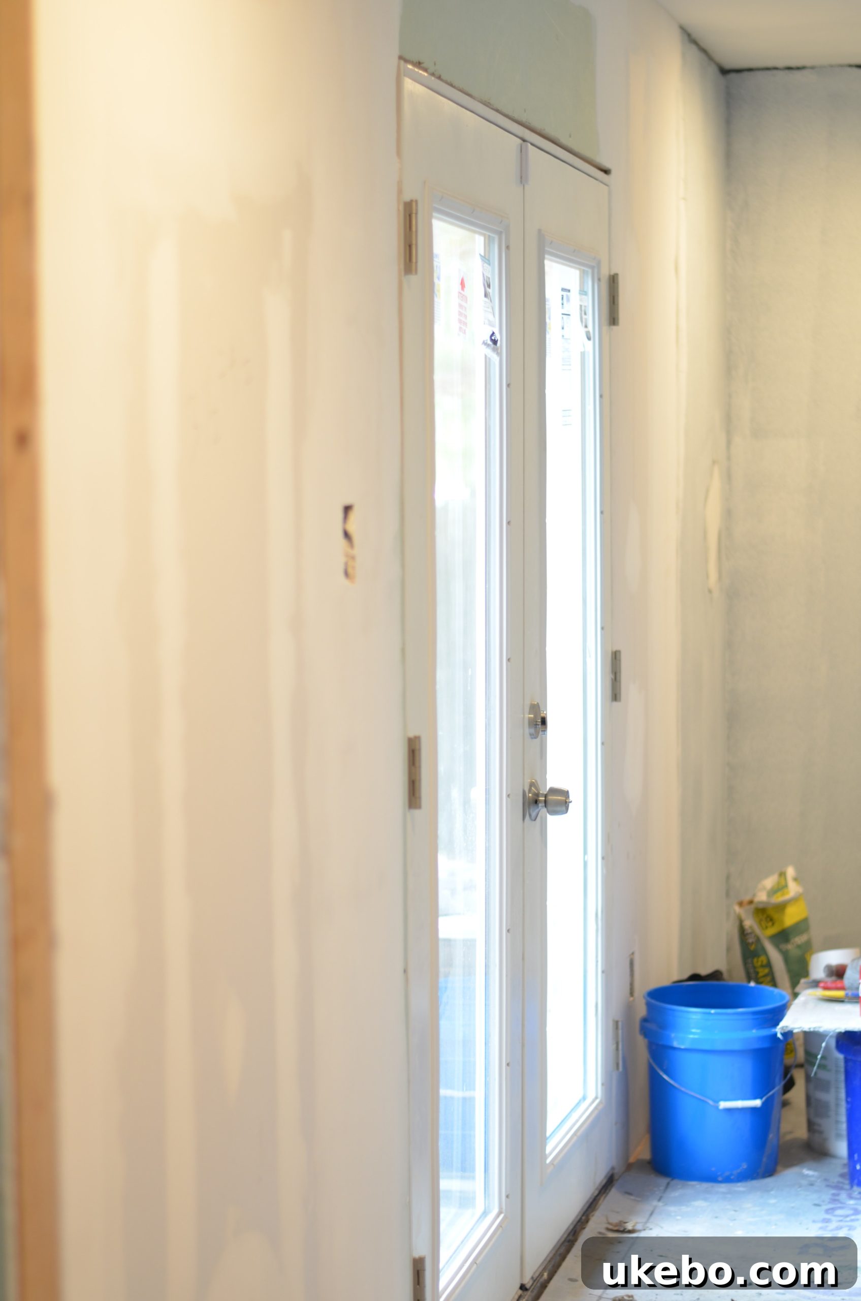Bedroom interior during One Room Challenge renovation with bare walls