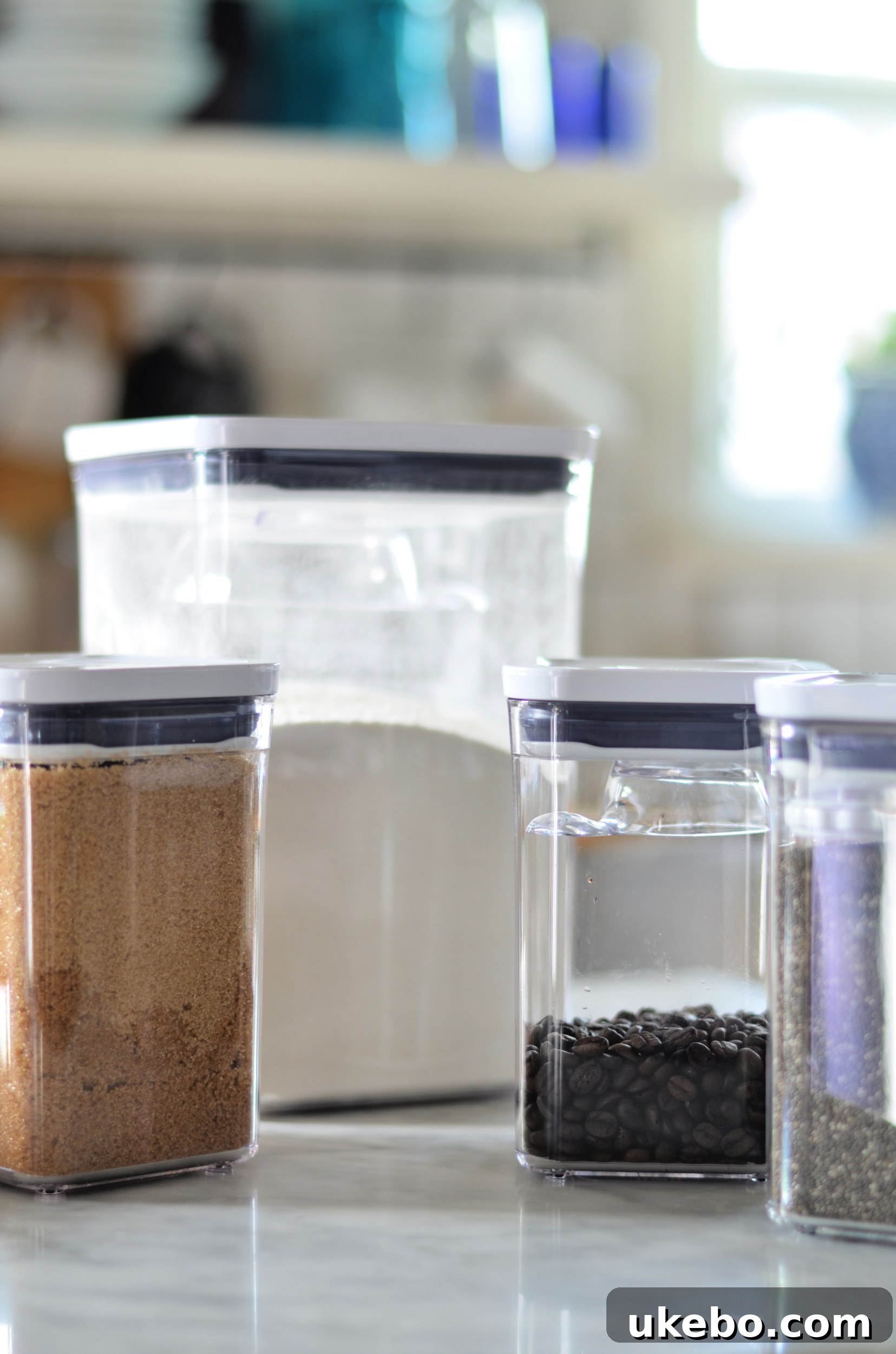 Another view of the newly organized pantry, highlighting various sizes of OXO POP containers