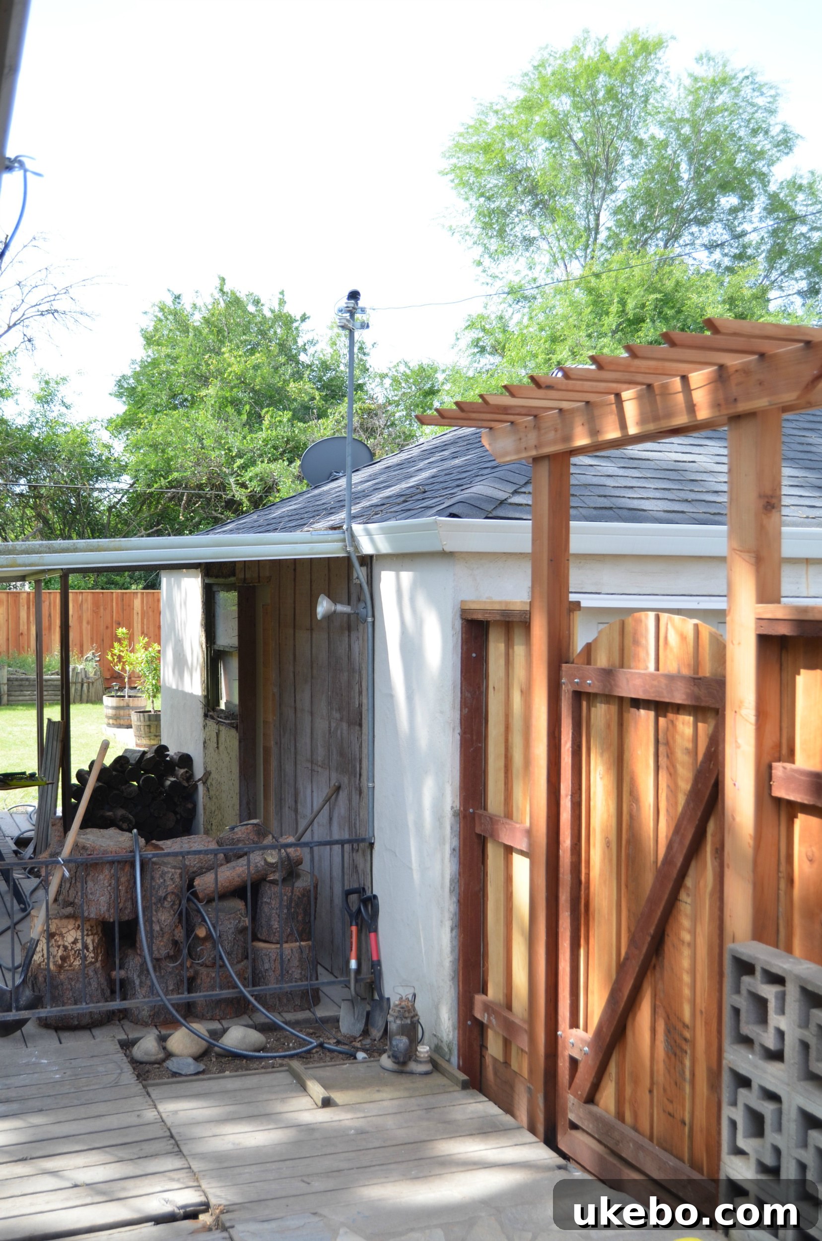 Backyard after initial clearing and new fence installation, revealing open space