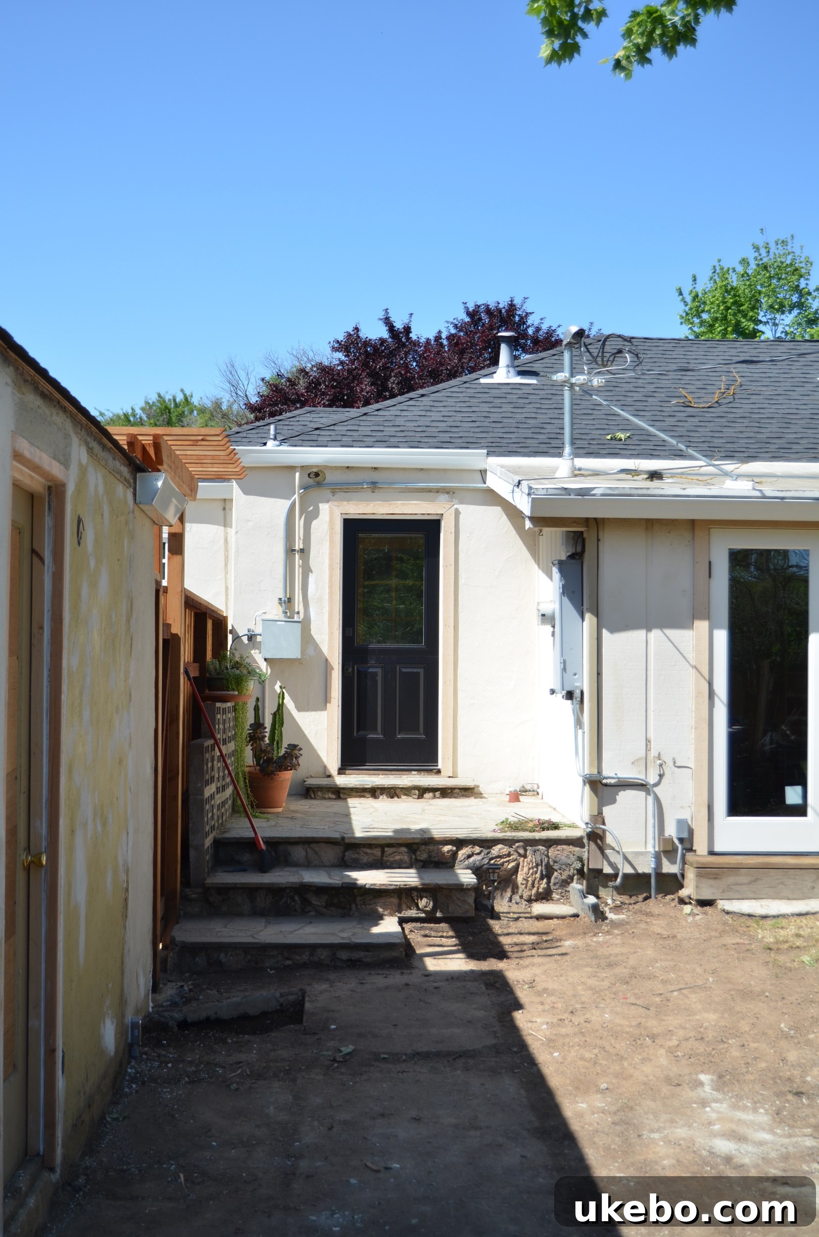 View of the backyard after shed removal and significant exterior home improvements