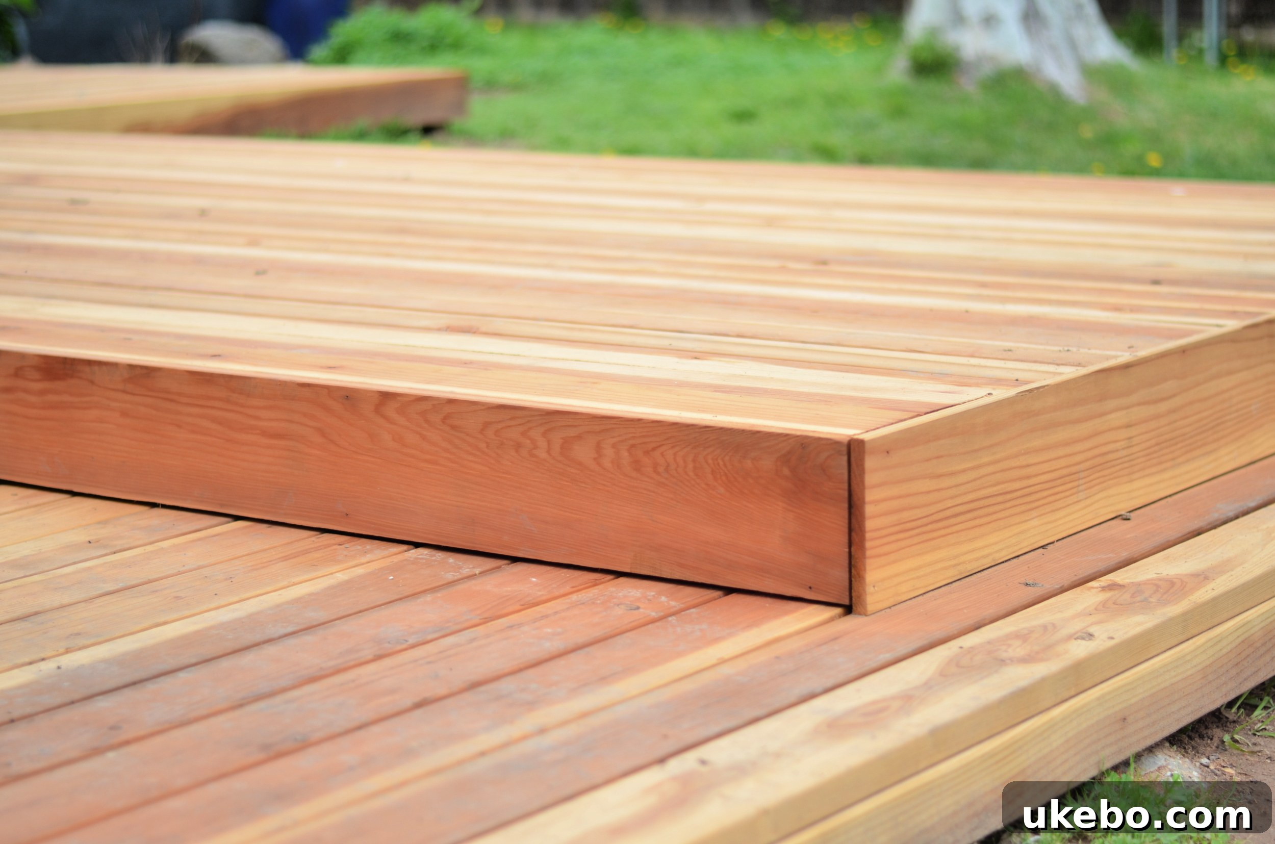 Beautiful new redwood deck gracefully connecting the main house to the garage building