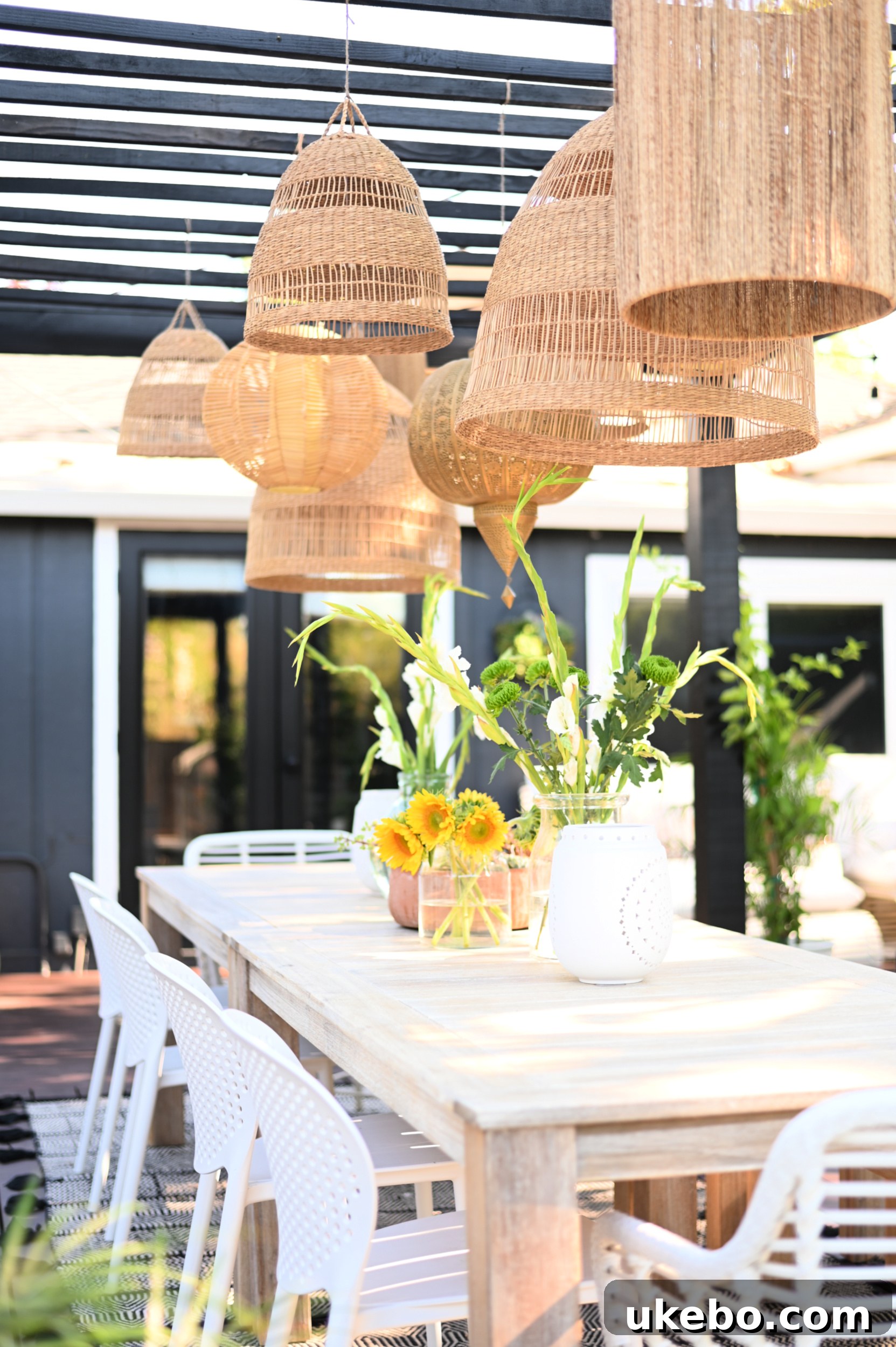 Close-up of dining table and chairs with pergola