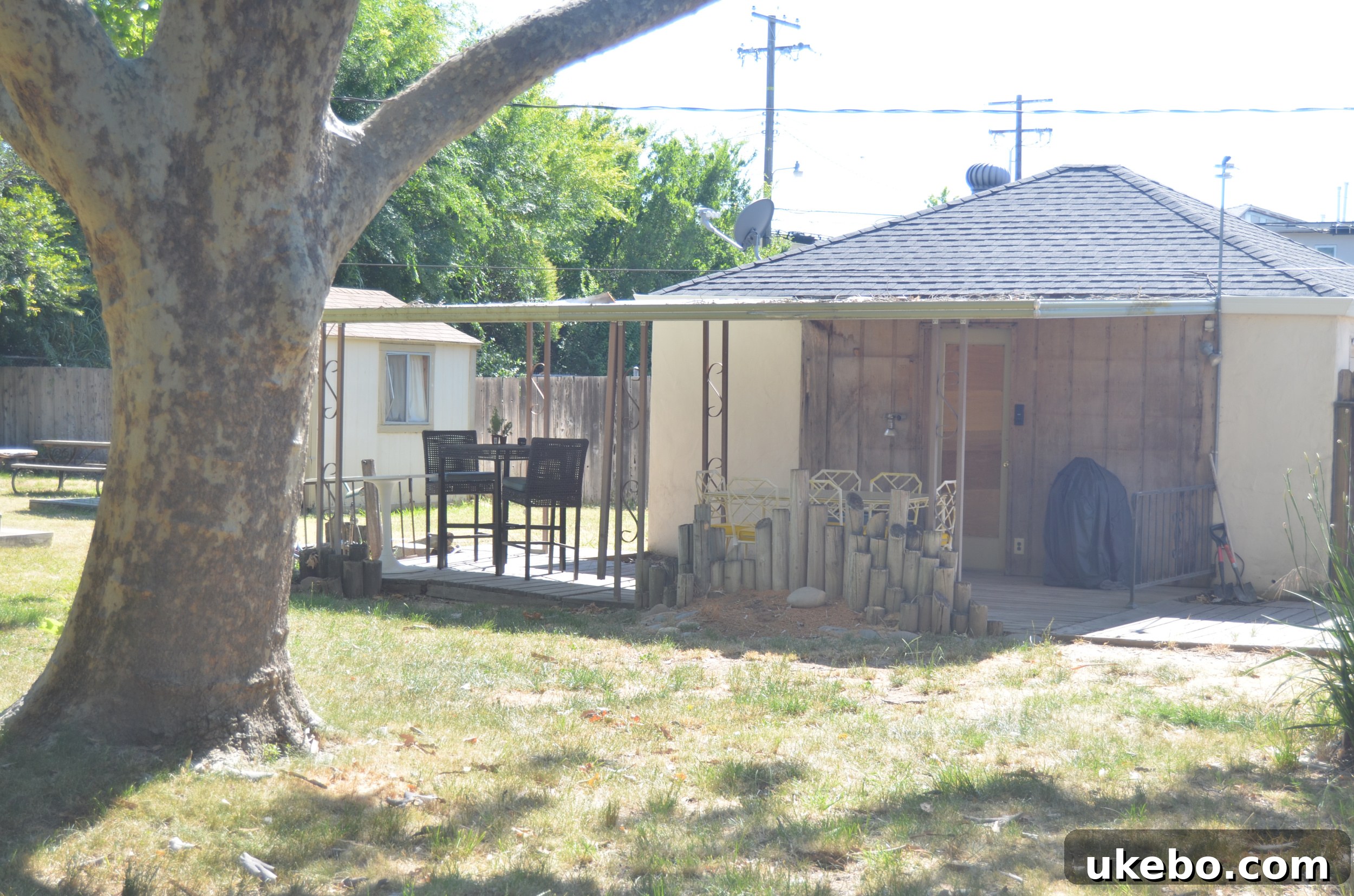 Backyard showing the house exterior before renovation