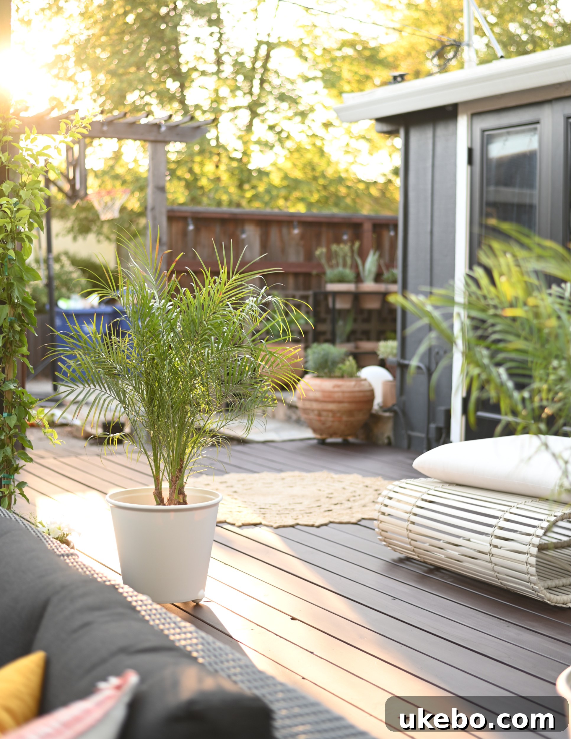 Outdoor seating with coral and teal pillows