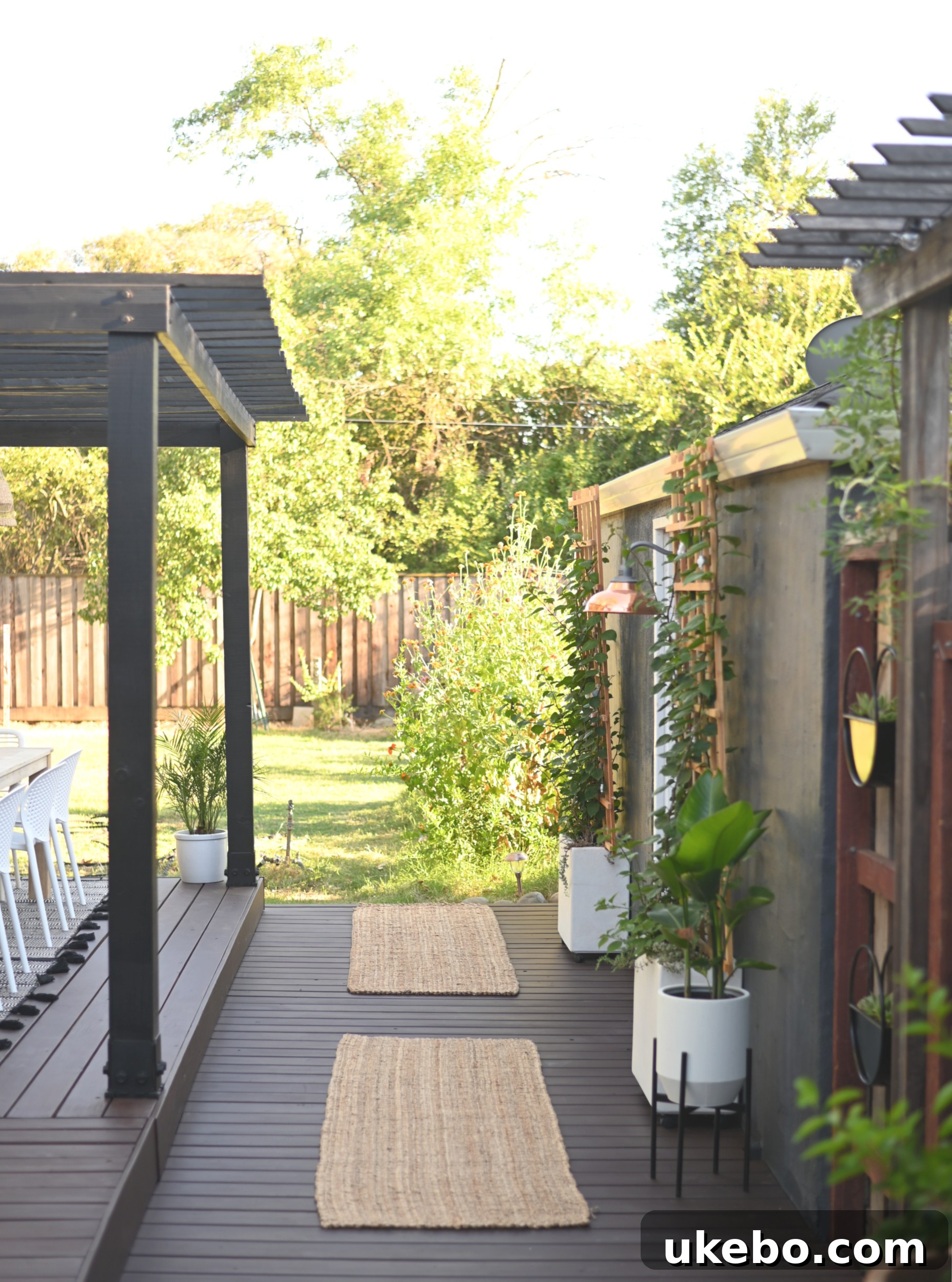 Dining area with black pergola and long table