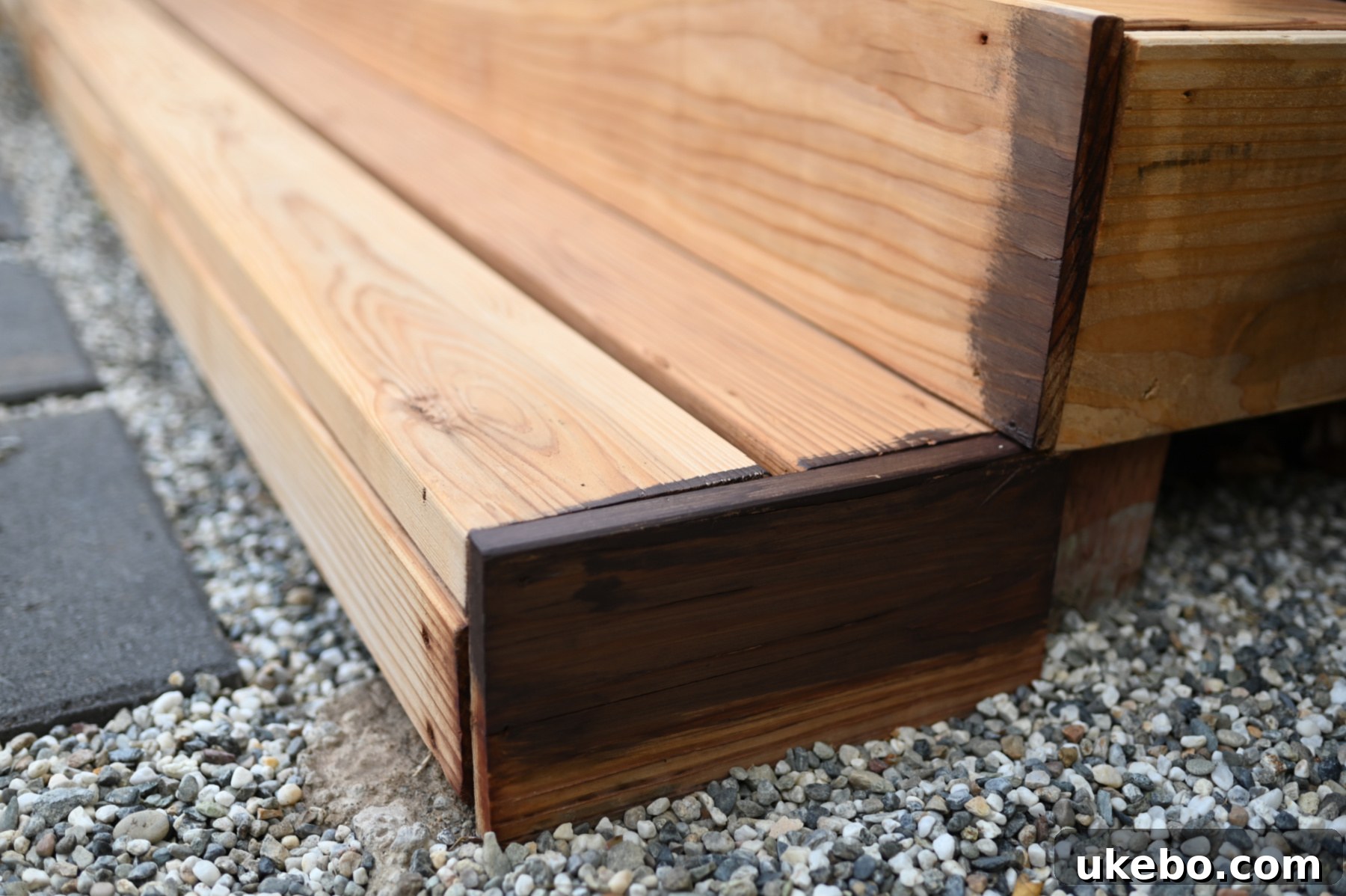 Bringing Our Deck Back to Life with Sherwin-Williams 16 Side-by-side comparison of unstained and stained redwood