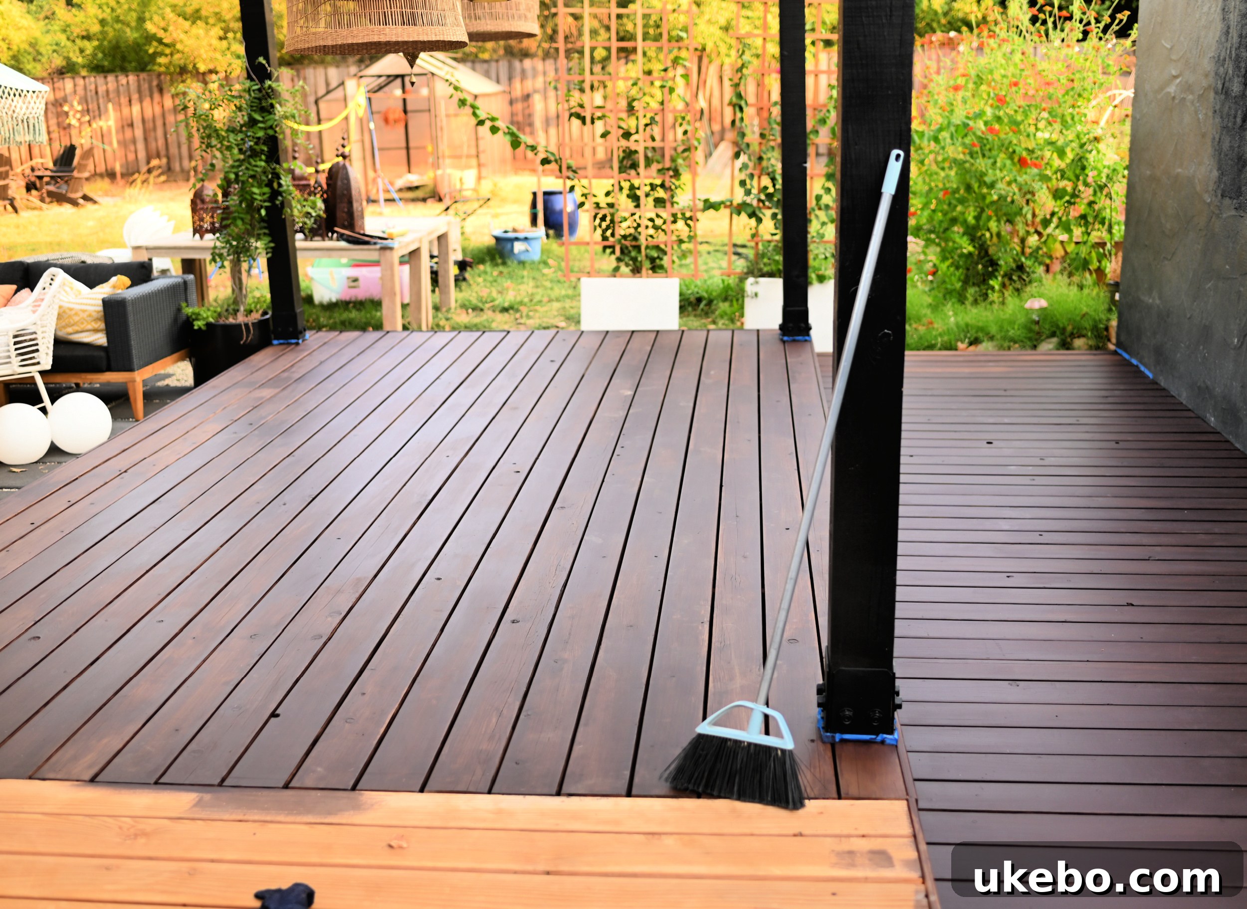 Bringing Our Deck Back to Life with Sherwin-Williams 25 Close-up showing the even application of the first stain coat