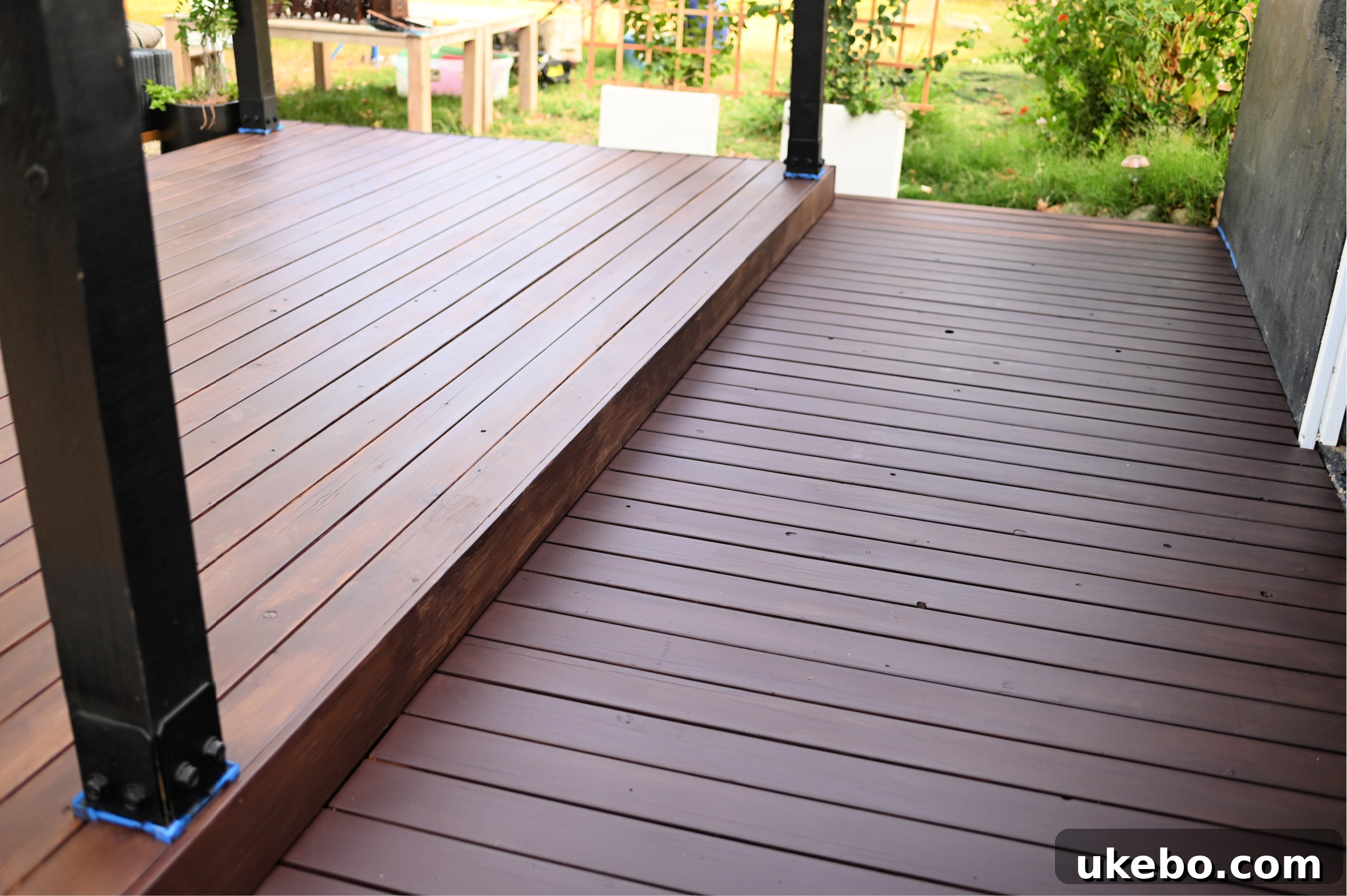 Bringing Our Deck Back to Life with Sherwin-Williams 26 Wide shot of the nearly completed first coat of deck stain