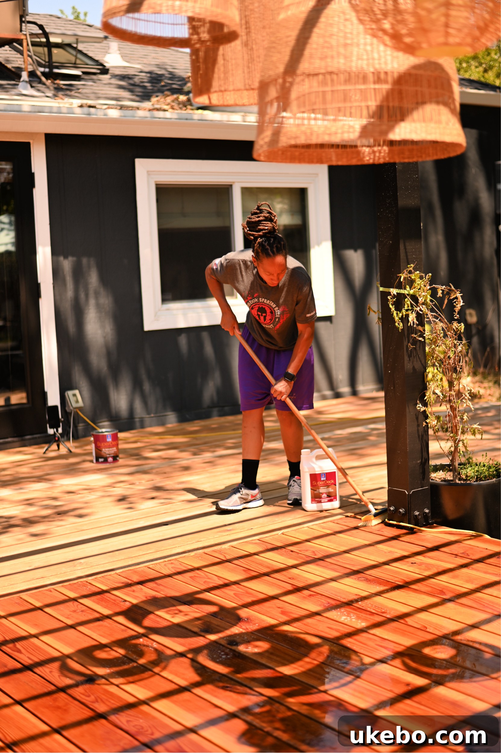 Scrubbing the deck with a poly bristle brush