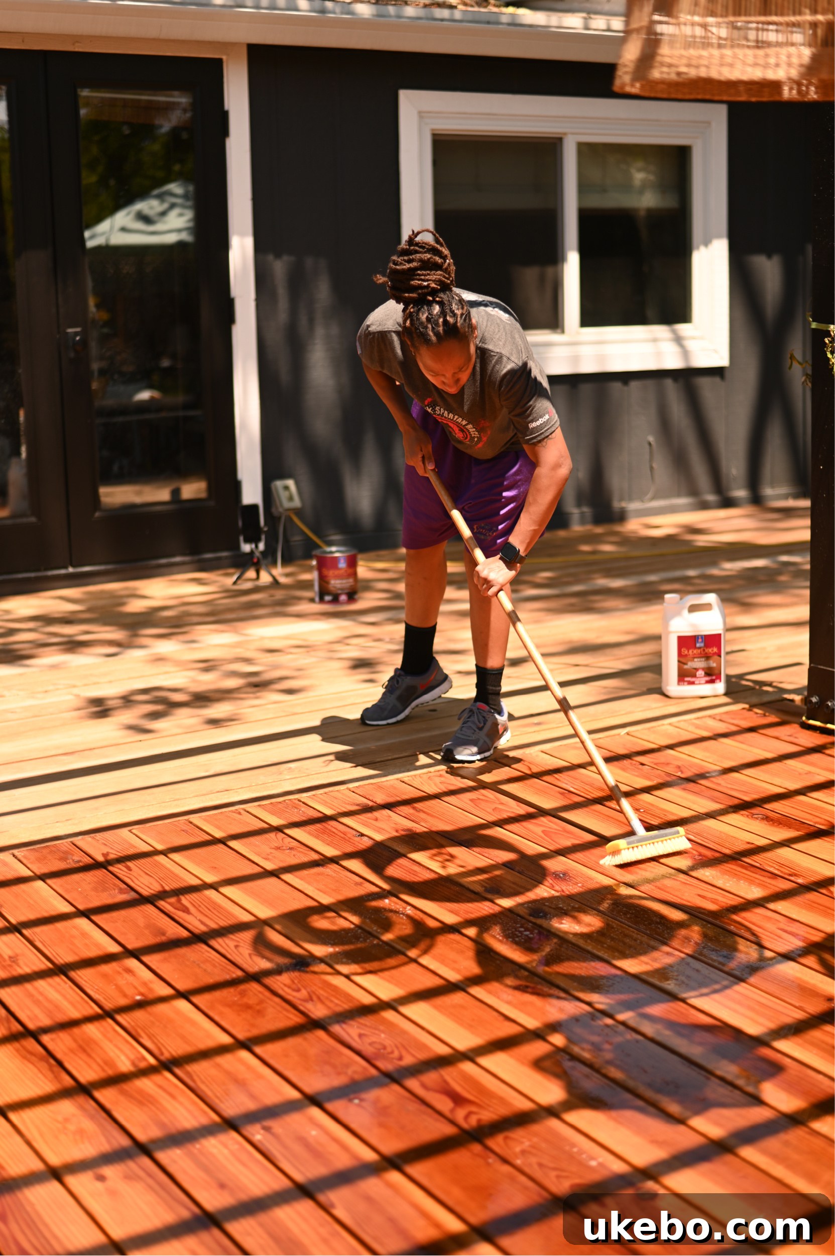 Bringing Our Deck Back to Life with Sherwin-Williams 9 Rinsing the deck after cleaning with SuperDeck Revive