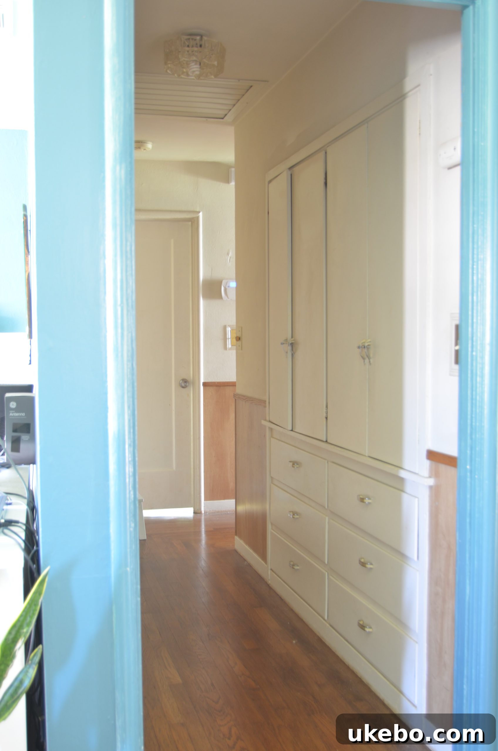 Initial hallway design showing outdated elements and limited natural light.