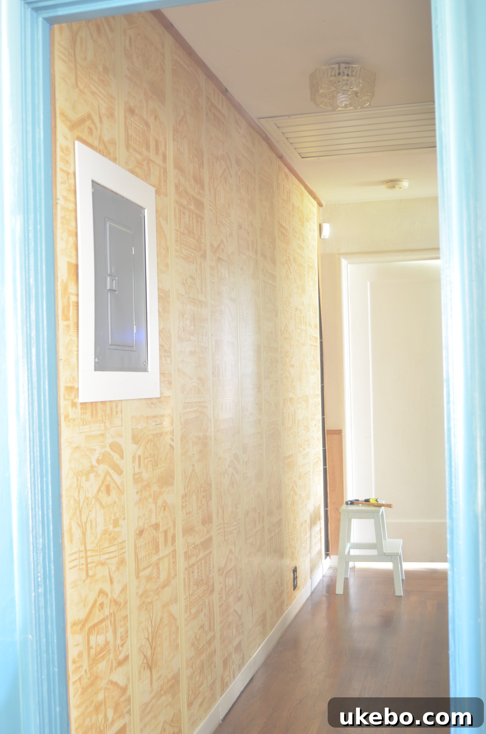 Perspective of the original hallway, highlighting the need for a modern update.