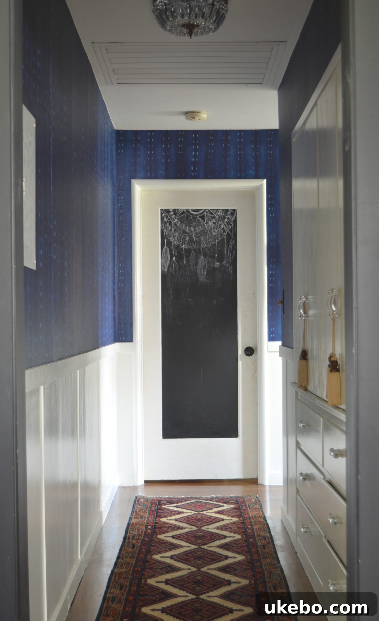 After renovation: A bright and stylish hallway featuring shibori wallpaper.