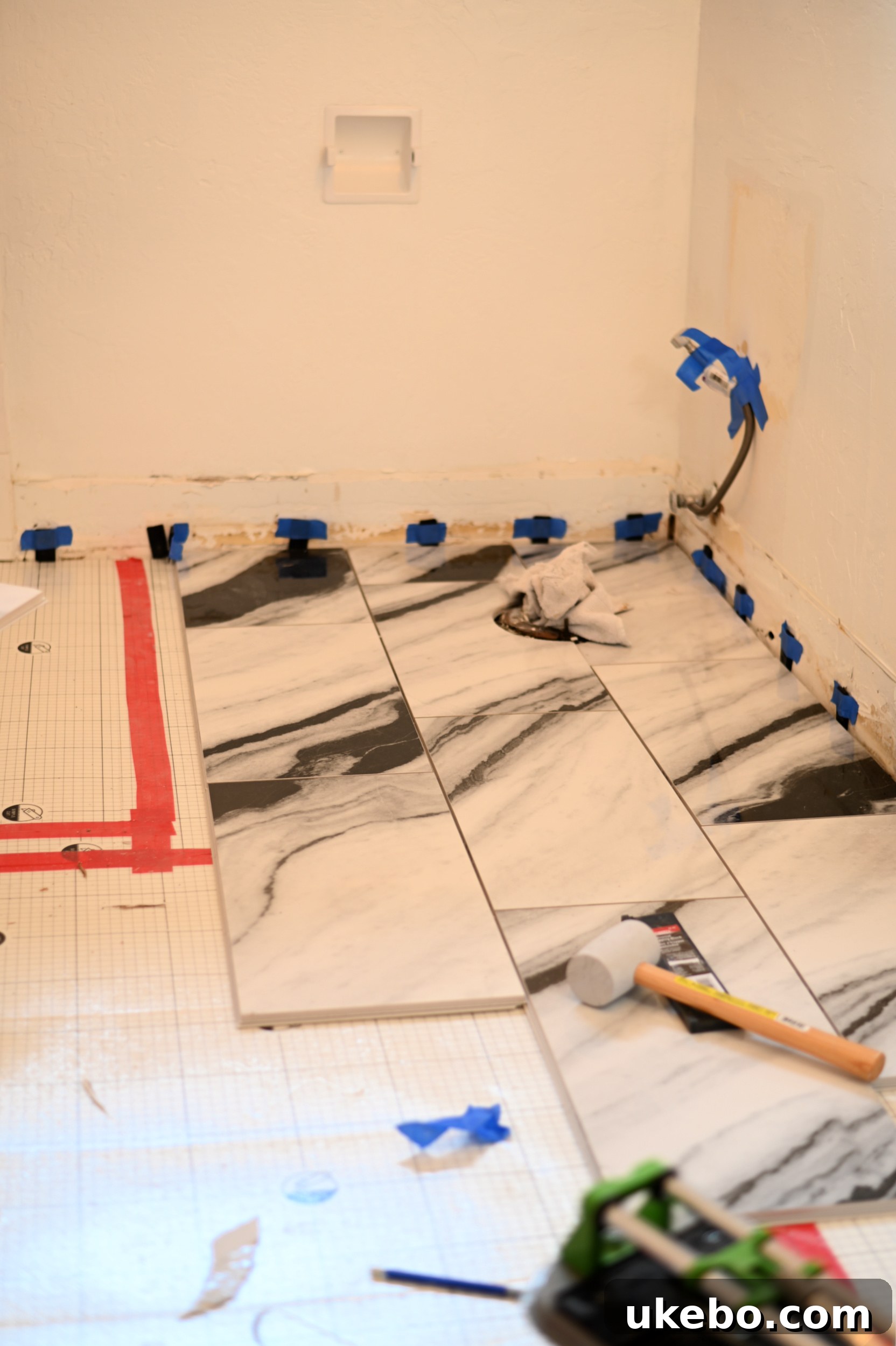 Image showing the QuicPrep underlayment laid out on the bathroom floor, ready for tile.