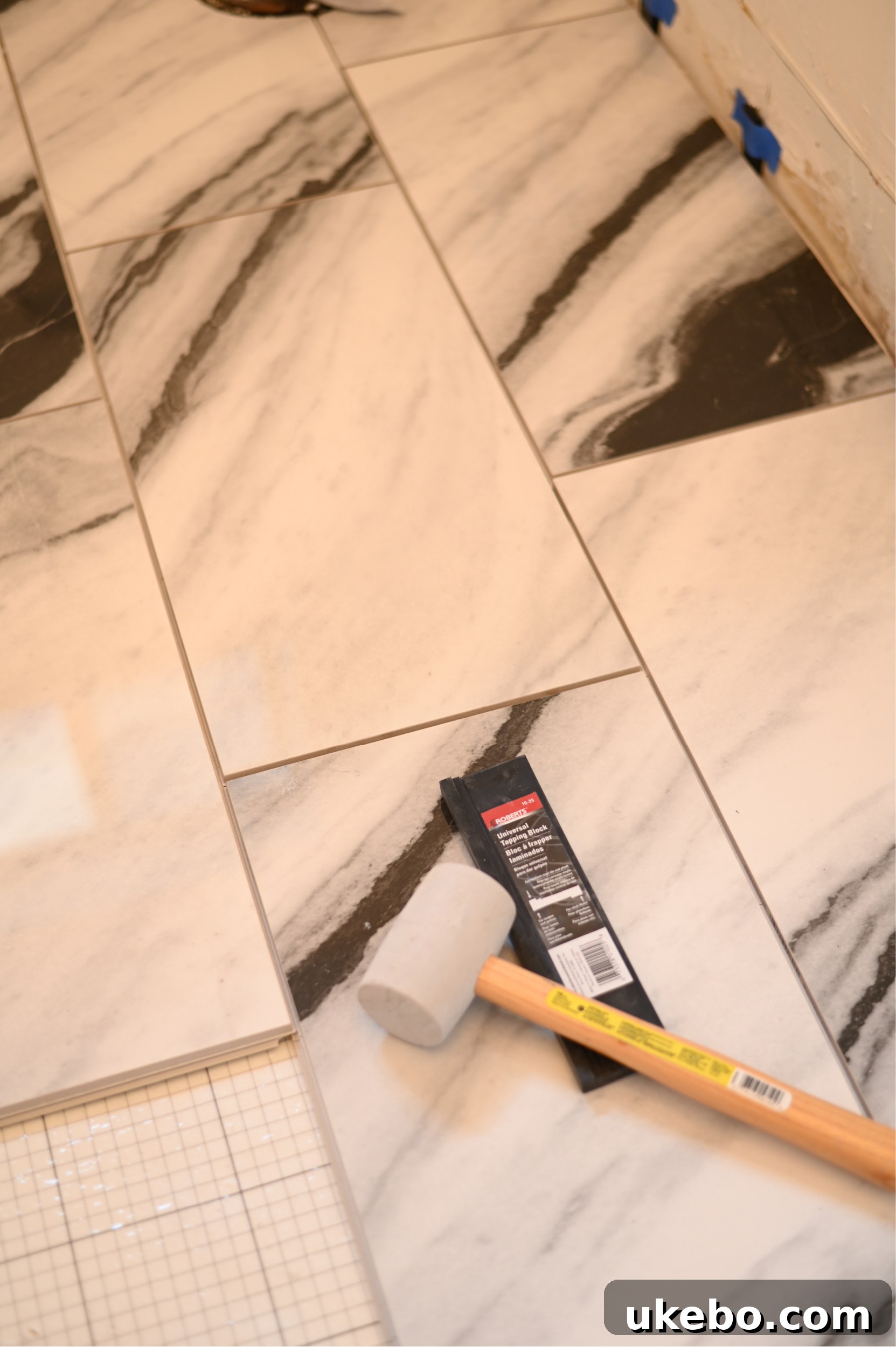 A close-up of the QuicTile installation process, showing the tiles clicking into place.