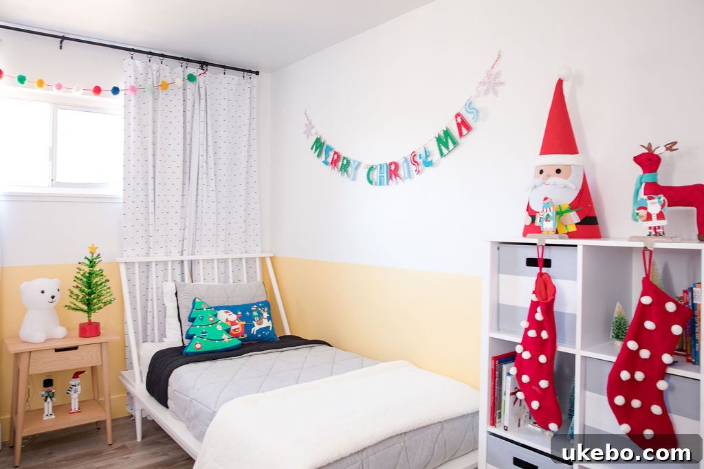 Cozy reading nook with a themed Christmas tree and kids' activity table, creating a distinct play zone in the twins' room.