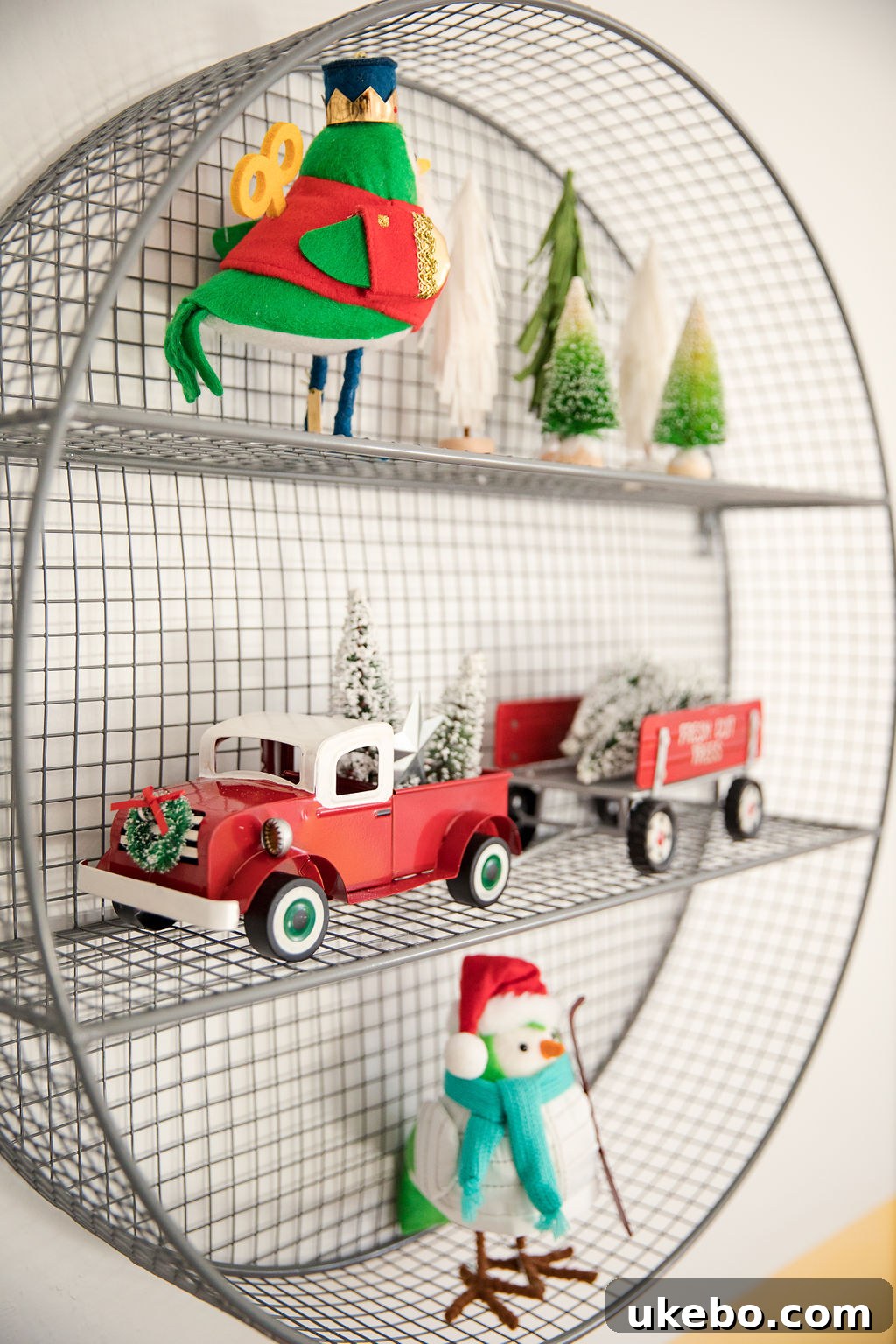 Detailed view of the kids' play area with a table and chairs, decorated for the holidays and encouraging creativity.