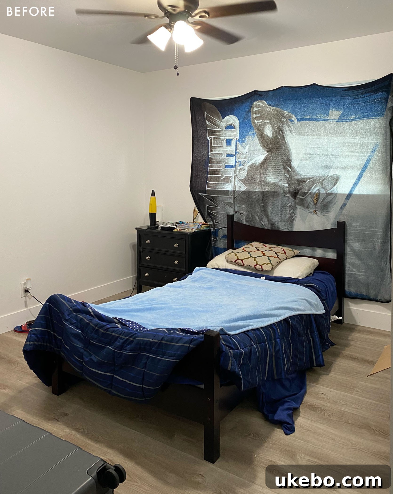 Devin's room before makeover, showing a simple, unadorned space with basic furniture