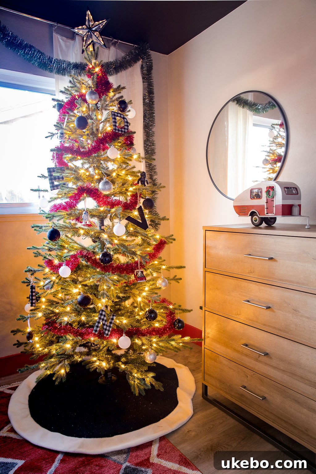 Close-up of holiday-themed bedding and decor on Devin's daybed