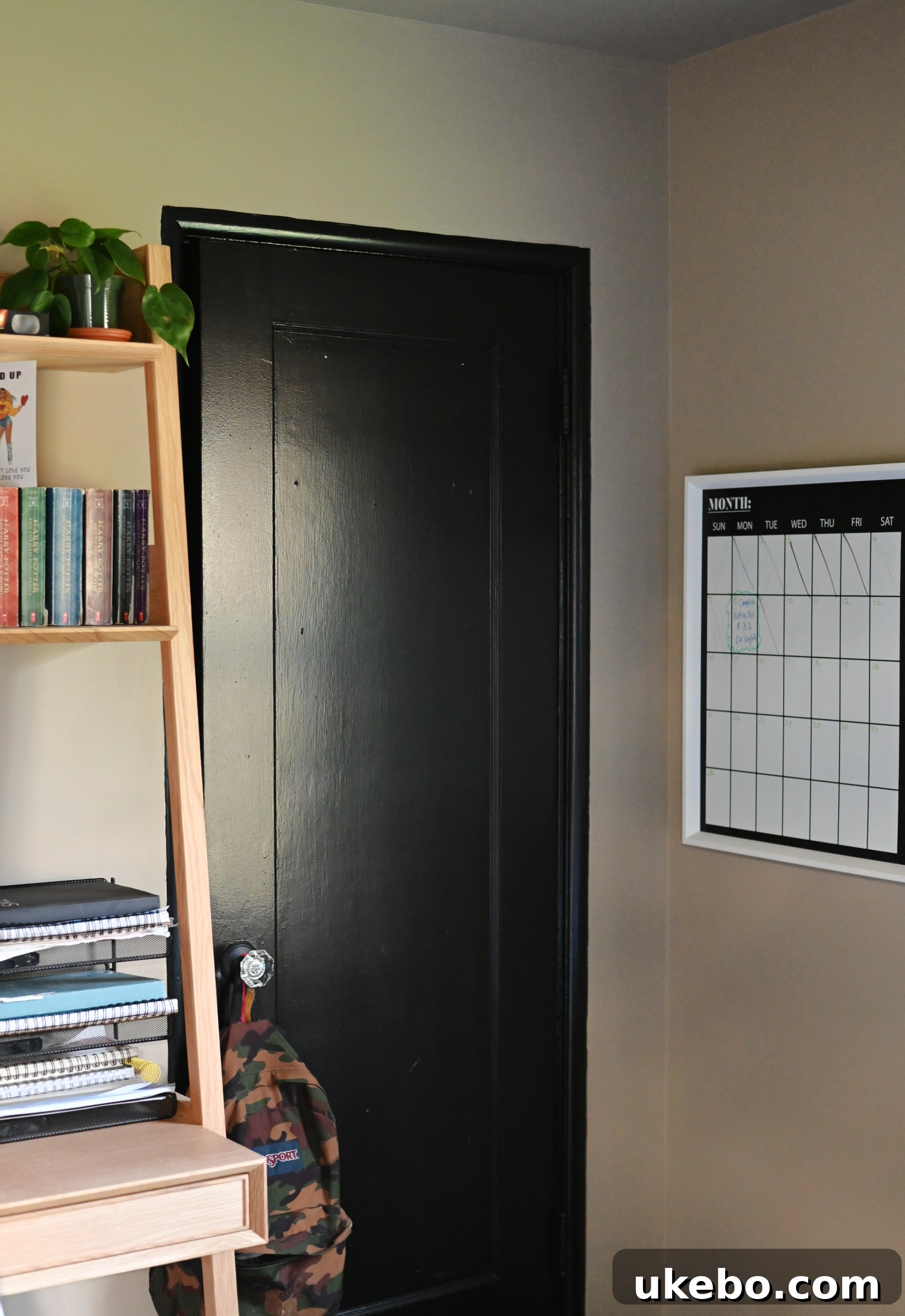 Michael's Modern Neutral Teen Bedroom Makeover 7 Close-up of the Sherwin-Williams Tony Taupe wall with Tricorn Black trim, showcasing the contrast in matte and satin finishes.