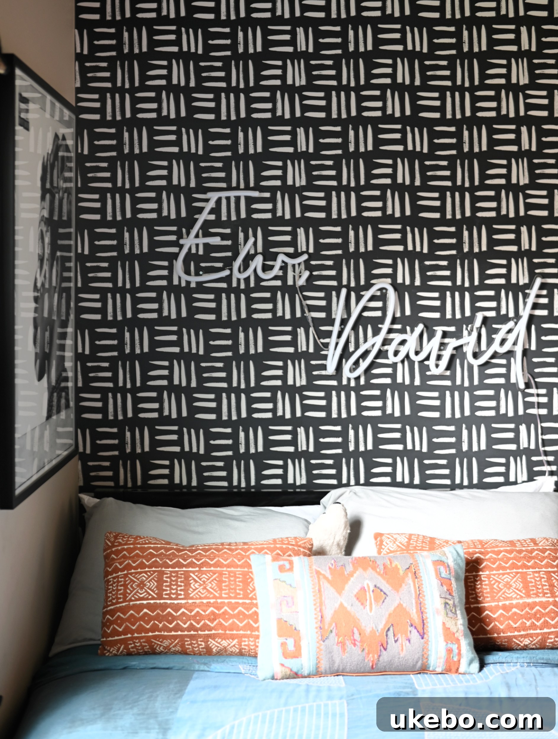 Personalized decor in Michael's room, including framed art and plants, reflecting his interests.