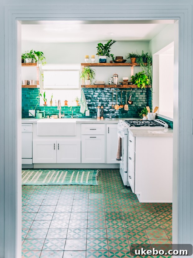 Justina Blakeney's kitchen featuring green cabinetry