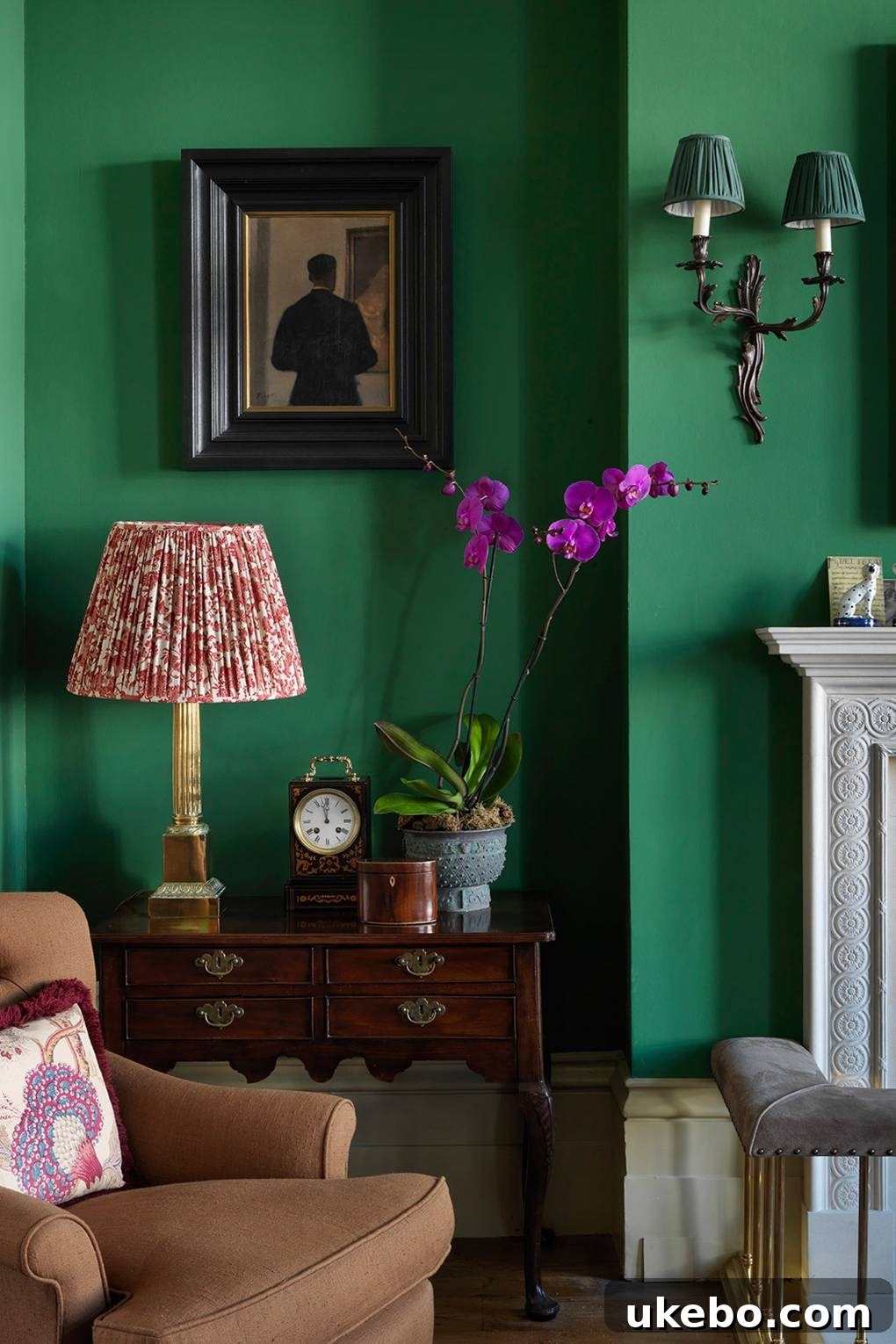 Elegant living space with emerald green walls and eclectic decor