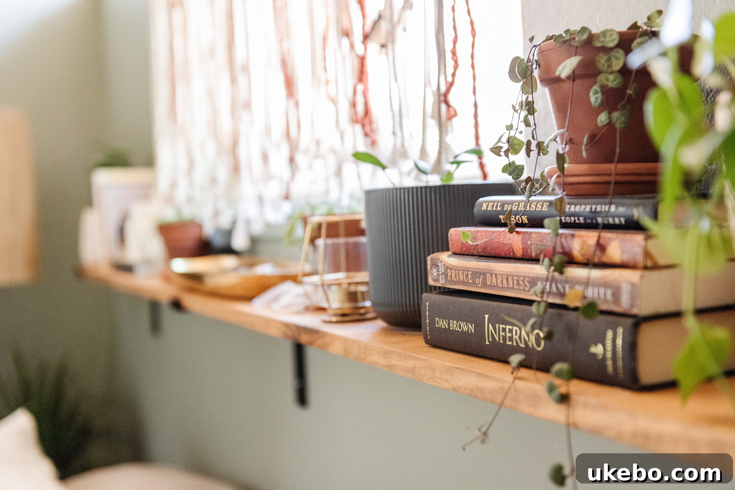 A closer look at the bedside area in the Evergreen Fog bedroom, featuring simple decor and a focus on natural materials.