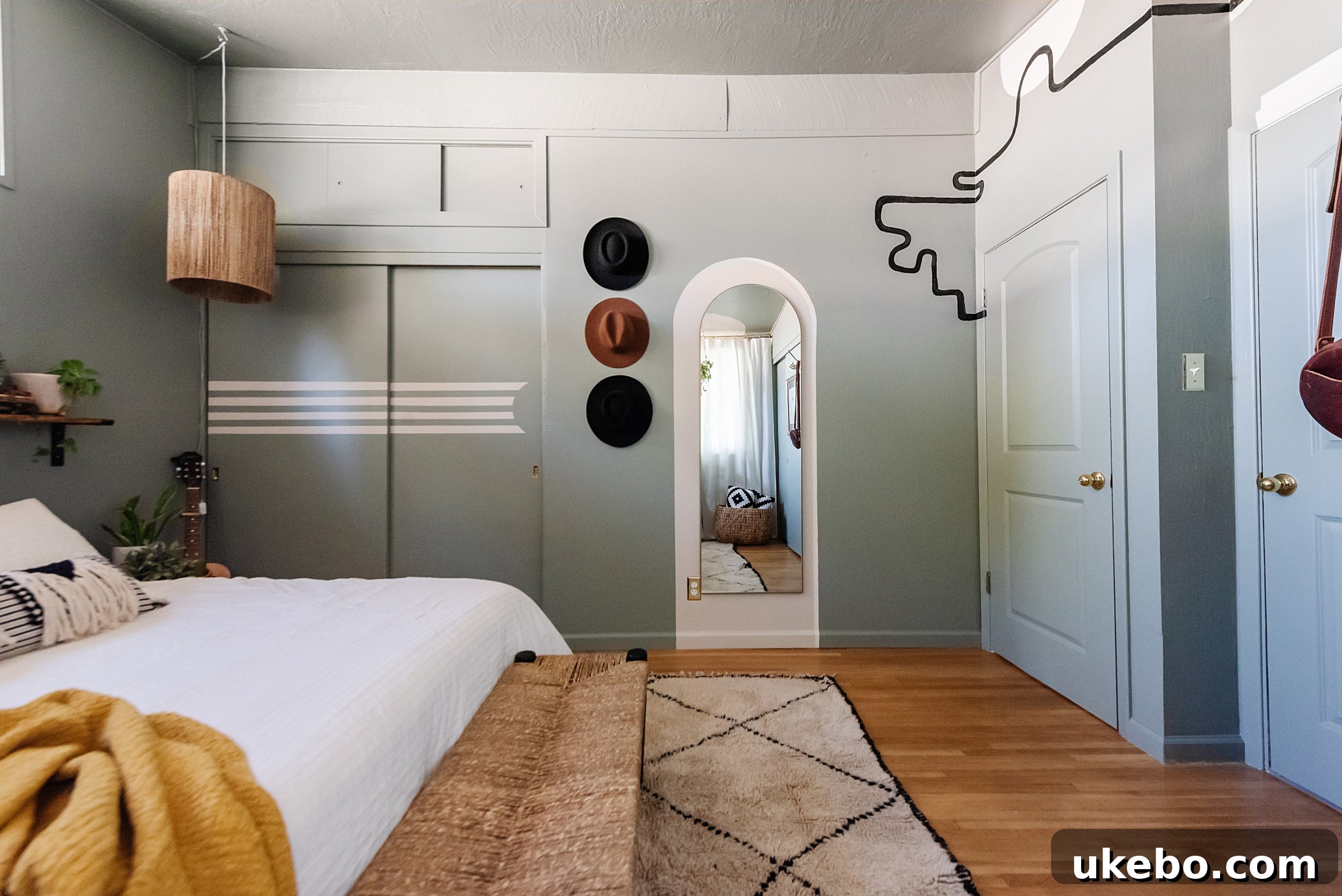 A handcrafted macrame window screen in the Evergreen Fog bedroom, serving as both privacy and artistic decor.