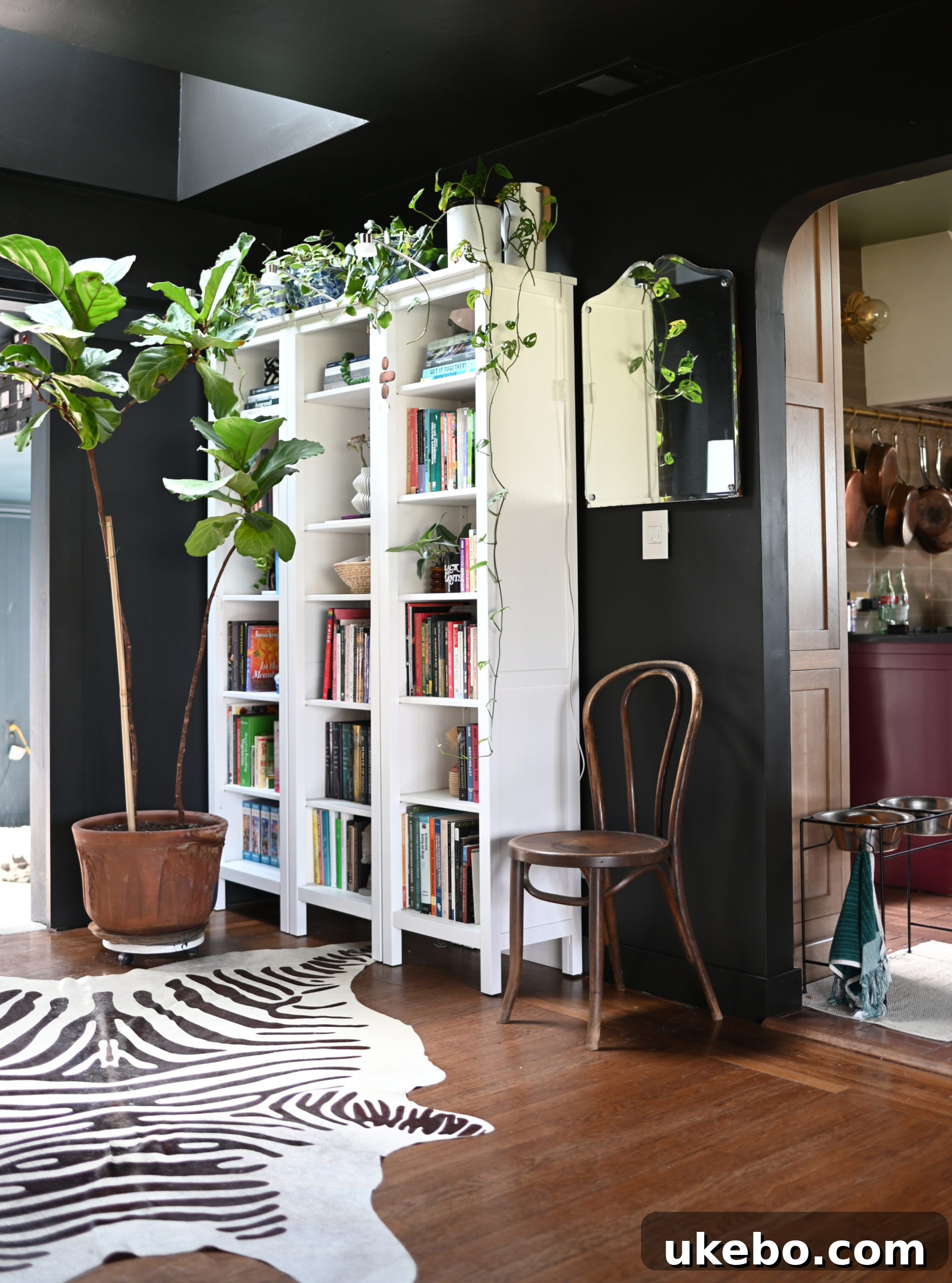 New library and bar area with abundant natural light from the VELUX skylight, showcasing bright interiors