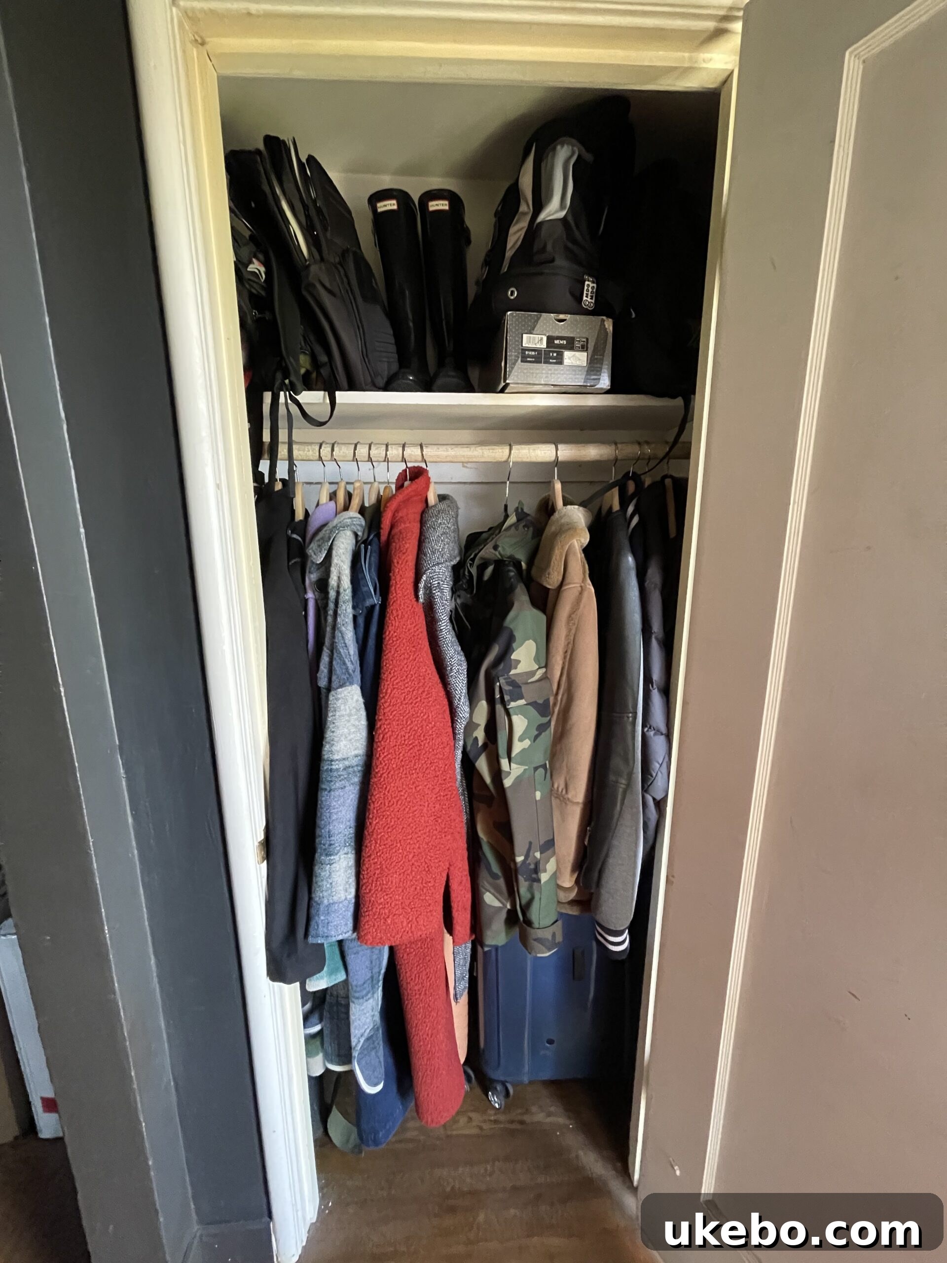 Before shot of entryway closet with shoes and bags