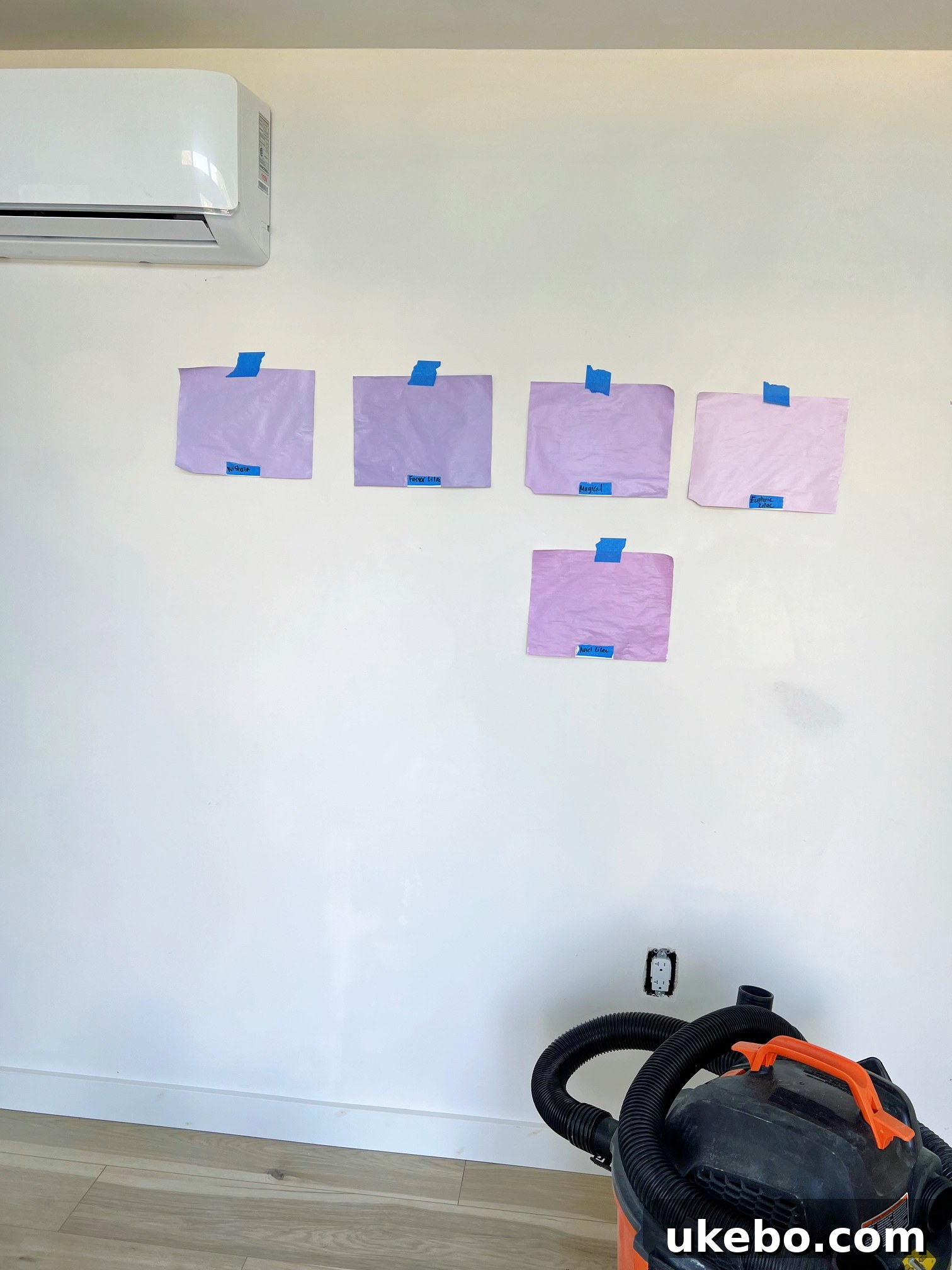 Various lilac and purple paint swatches being evaluated for the office studio
