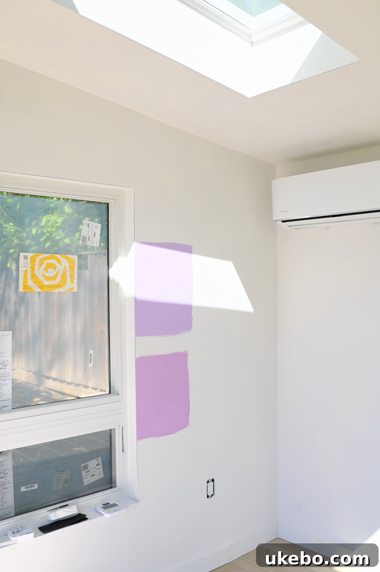 Comparing Sherwin-Williams Magical SW 6829 and Novel Lilac SW 6836 on a wall