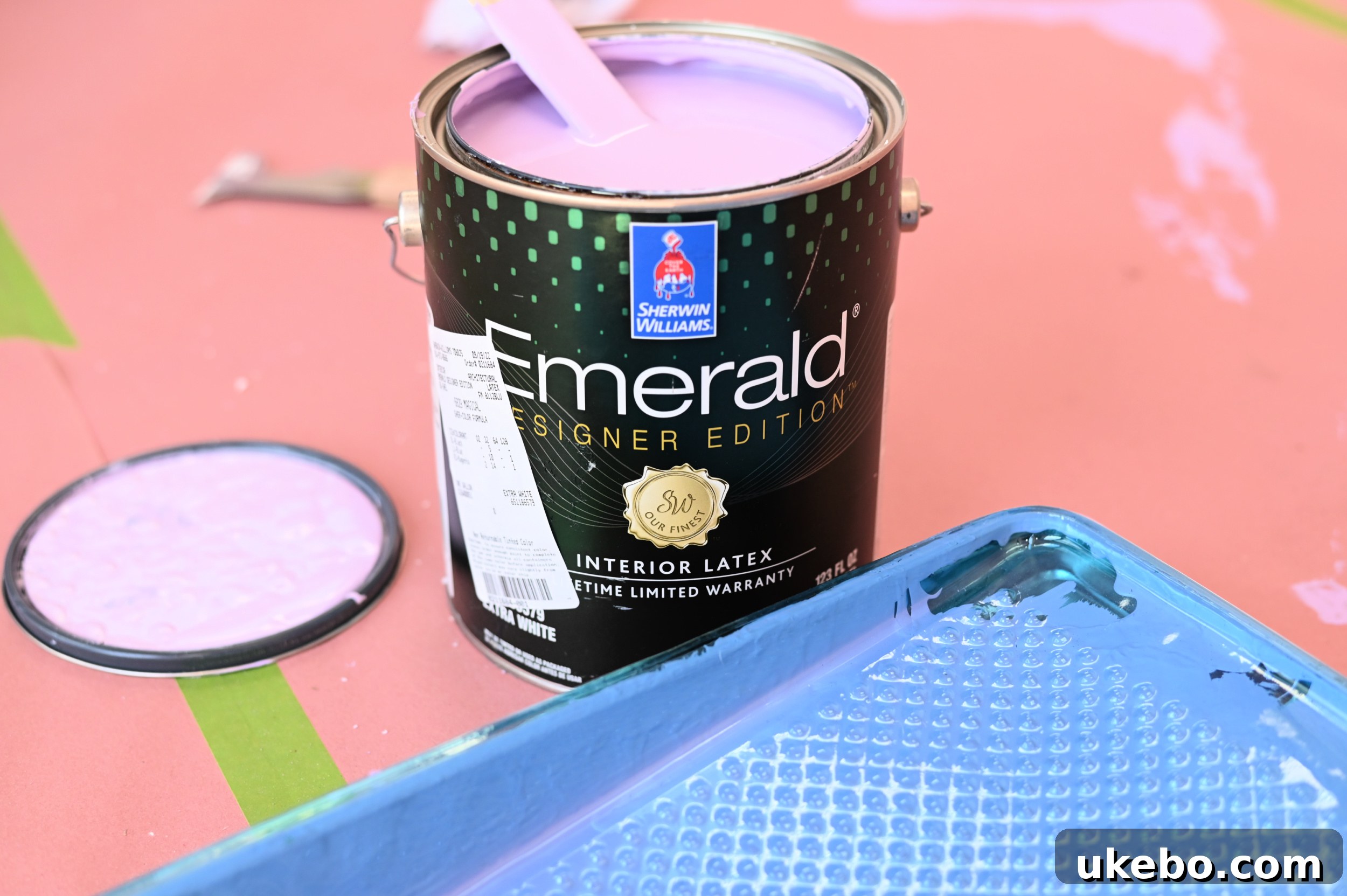 The process of painting the office walls with Sherwin-Williams Magical SW 6829