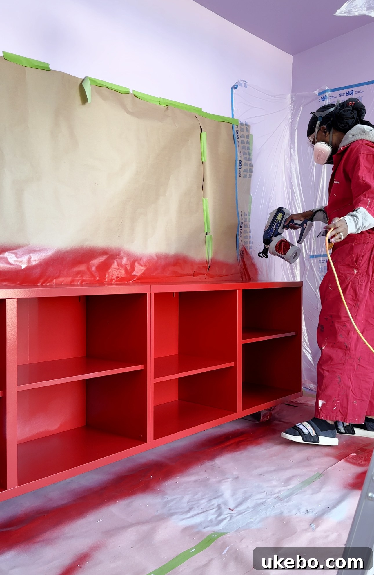 Vibrant red console painted with Sherwin-Williams Positive Red SW 6871 against purple walls