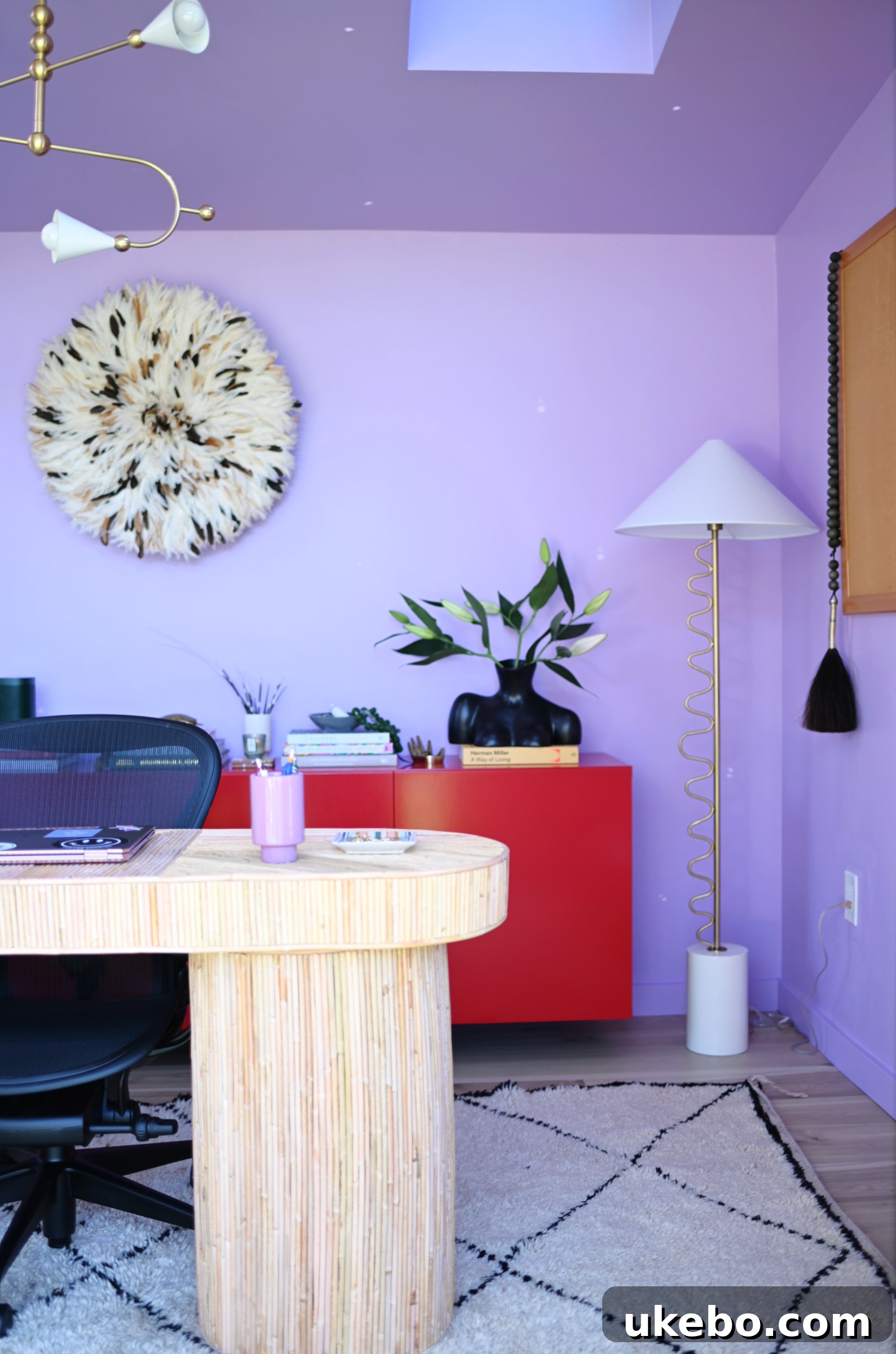 Cozy seating area within the purple office studio, inviting relaxation and inspiration