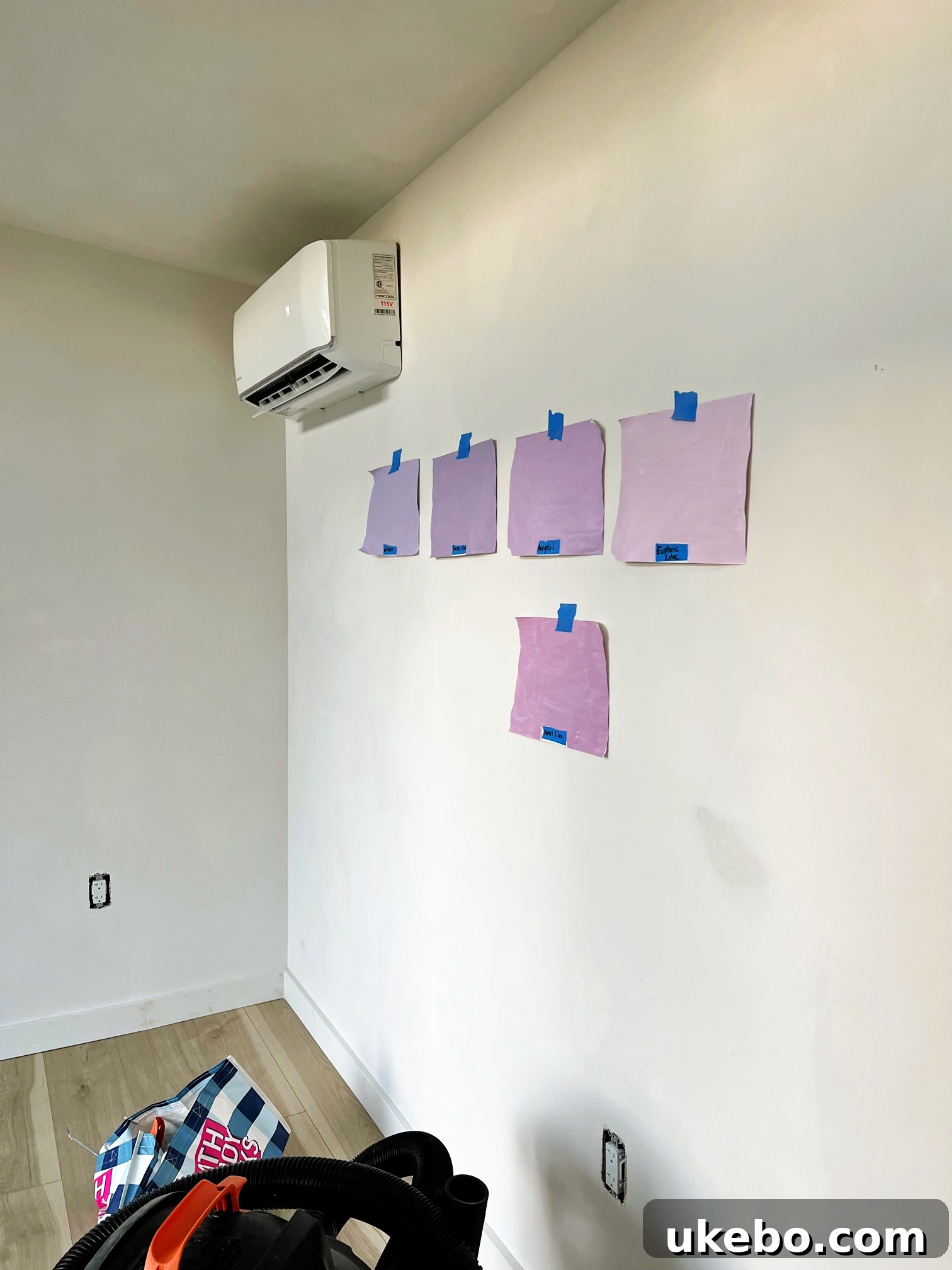 Sherwin-Williams Color to Go paint samples being tested on paper swatches